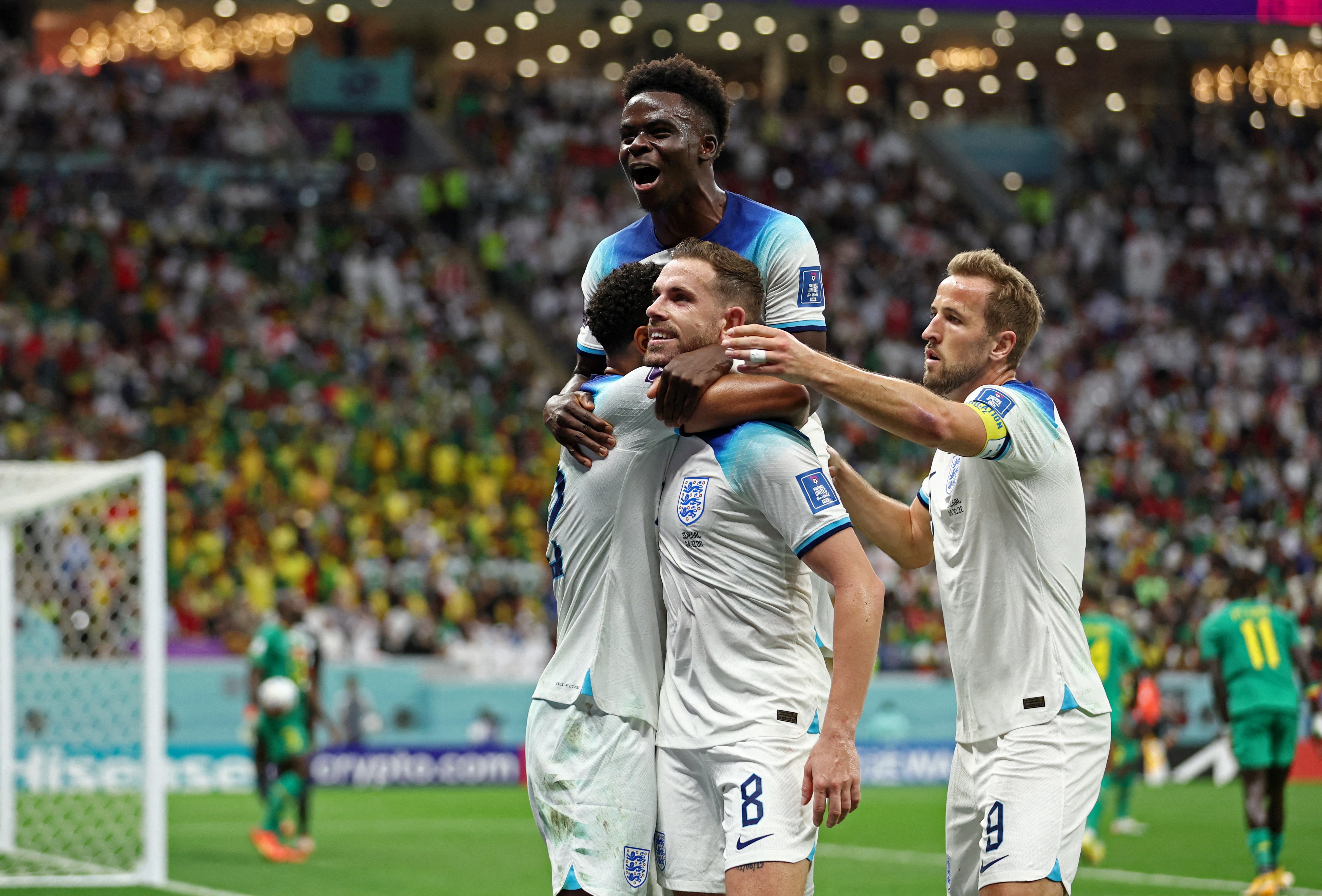 The squad celebrates Henderson’s goal