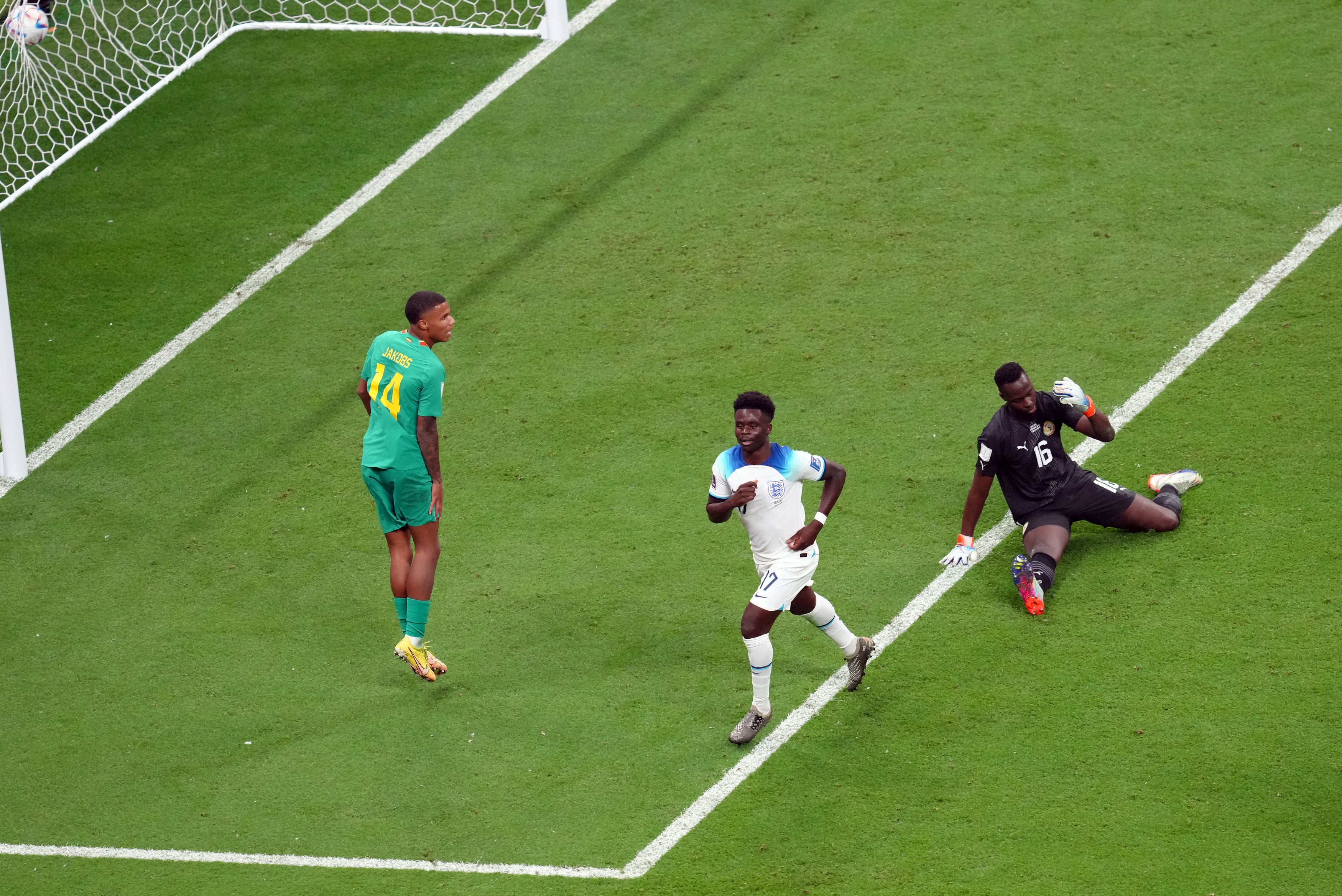 Saka celebrates his third goal of the tournament