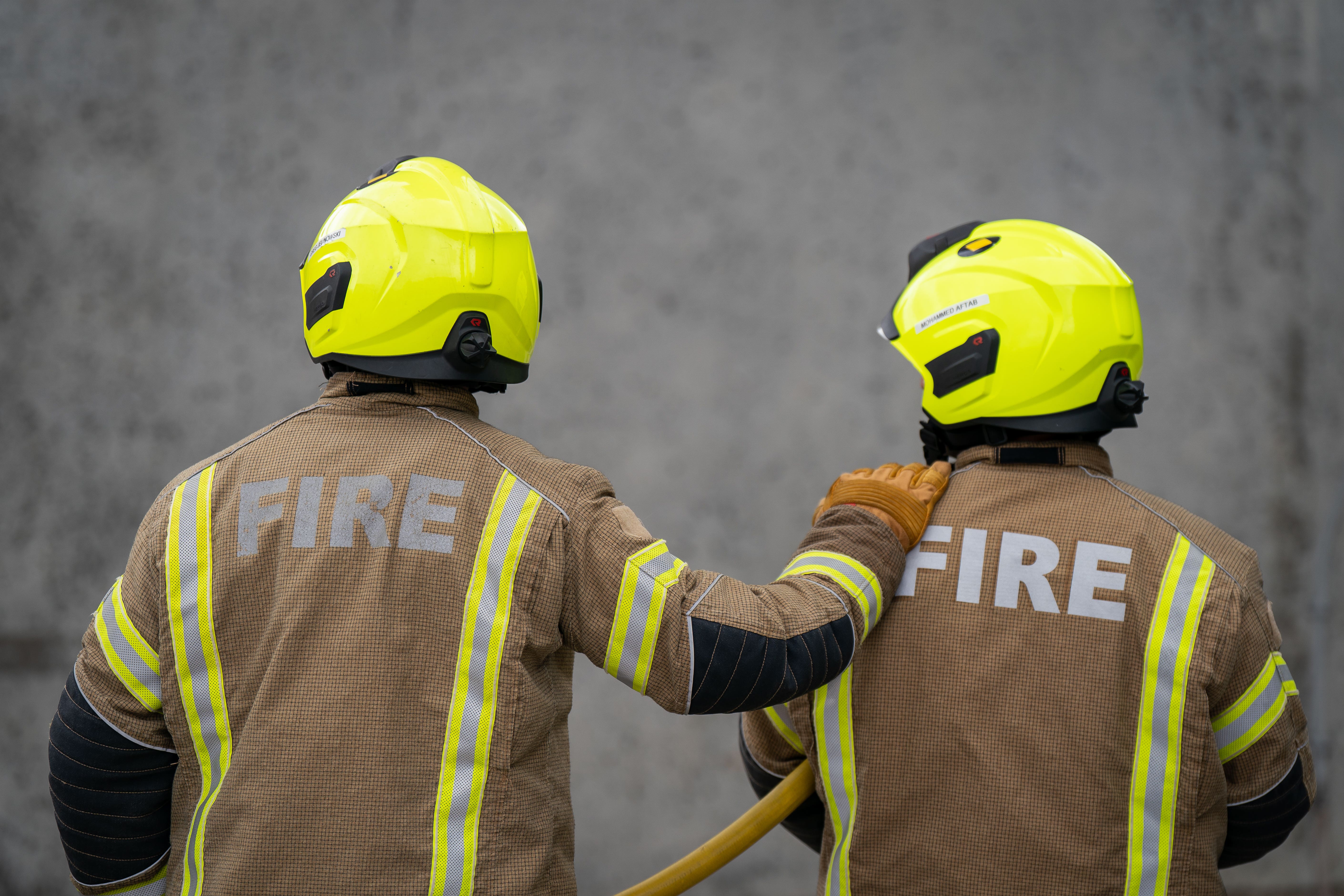 Fire Brigade recruits go through their paces during a drill (PA)