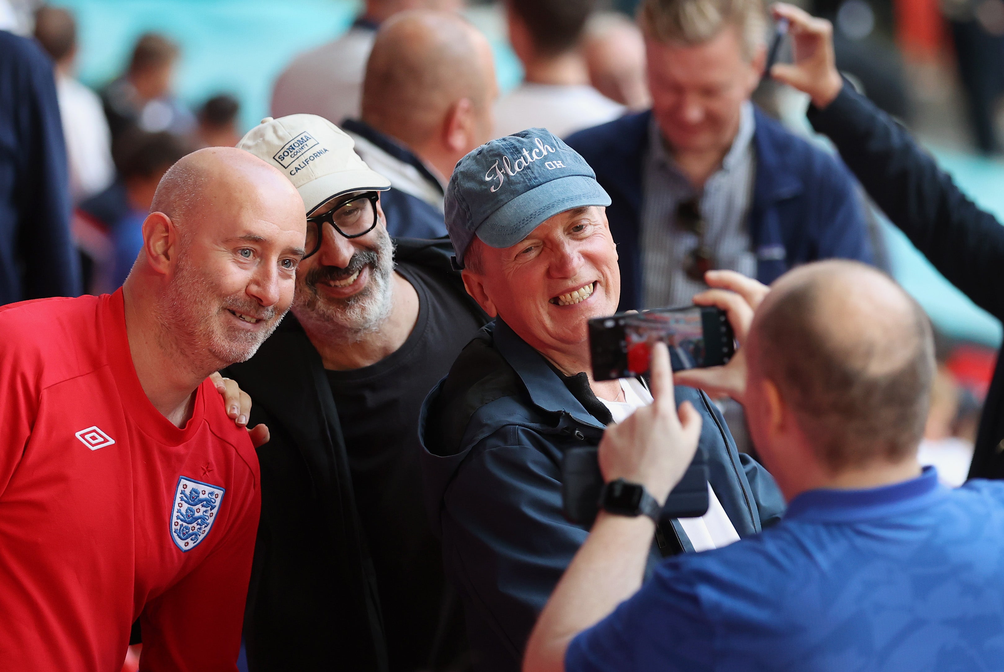 Frank Skinner and David Baddiel take a selfie with fans in the crowd during the UEFA Euro 2020 championship