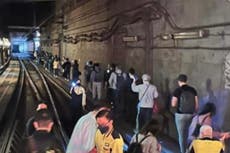 1,500 passengers evacuated along tracks after Hong Kong train breaks down in tunnel