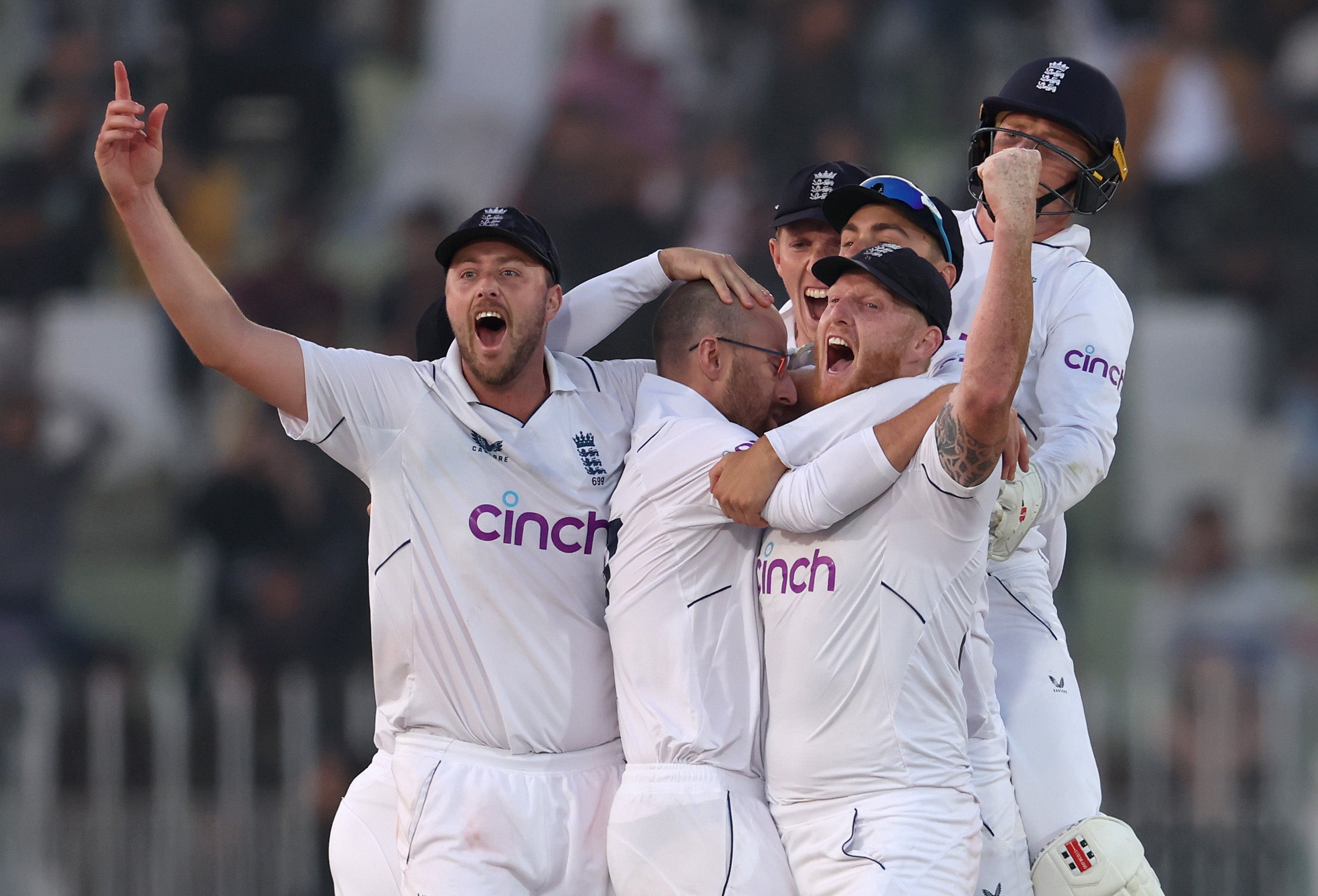 Ollie Robinson, Jack Leach and Ben Stokes of England celebrate winning