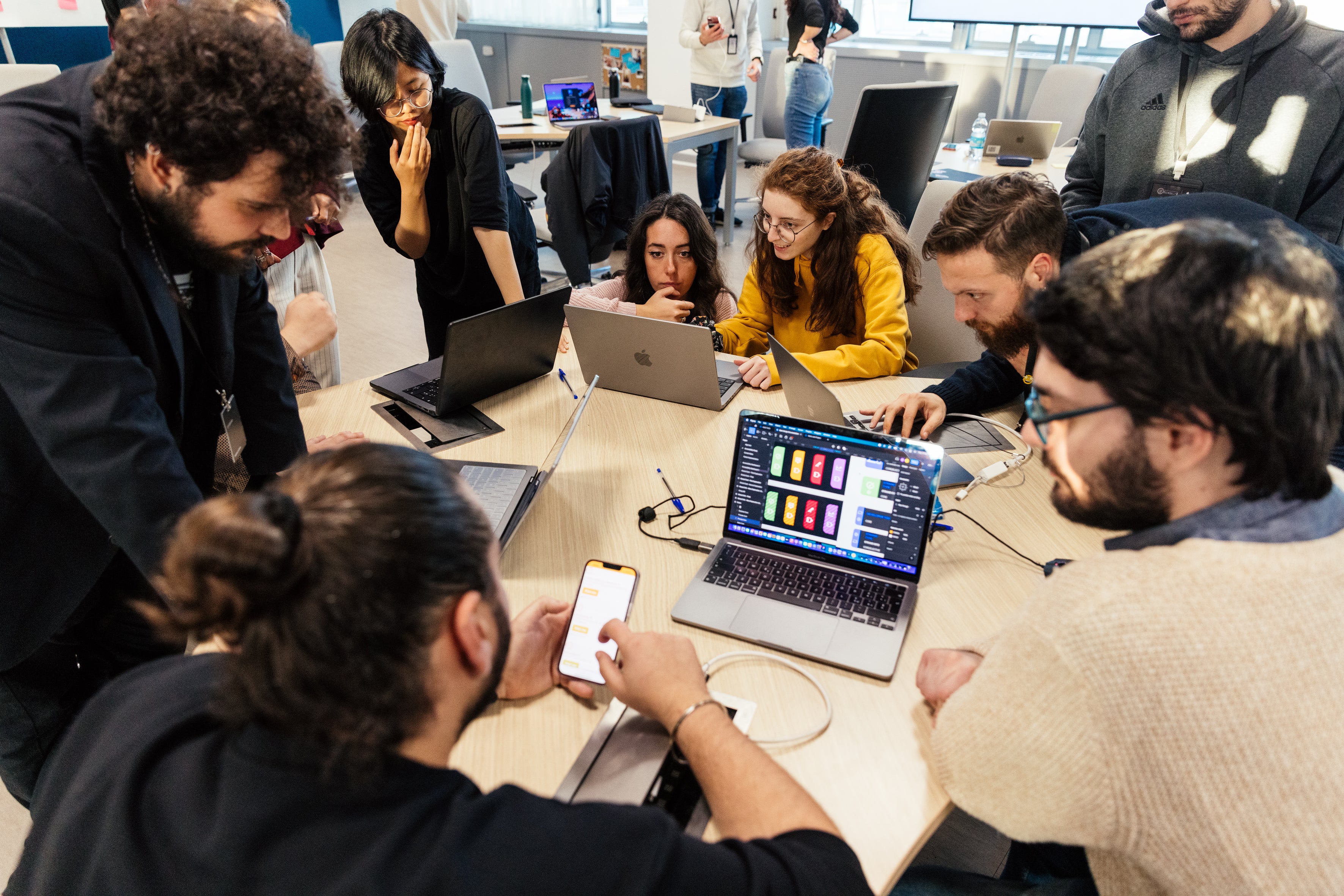 Apple Developer Academy students working together on a project during a developer workshop focussed on accessibility