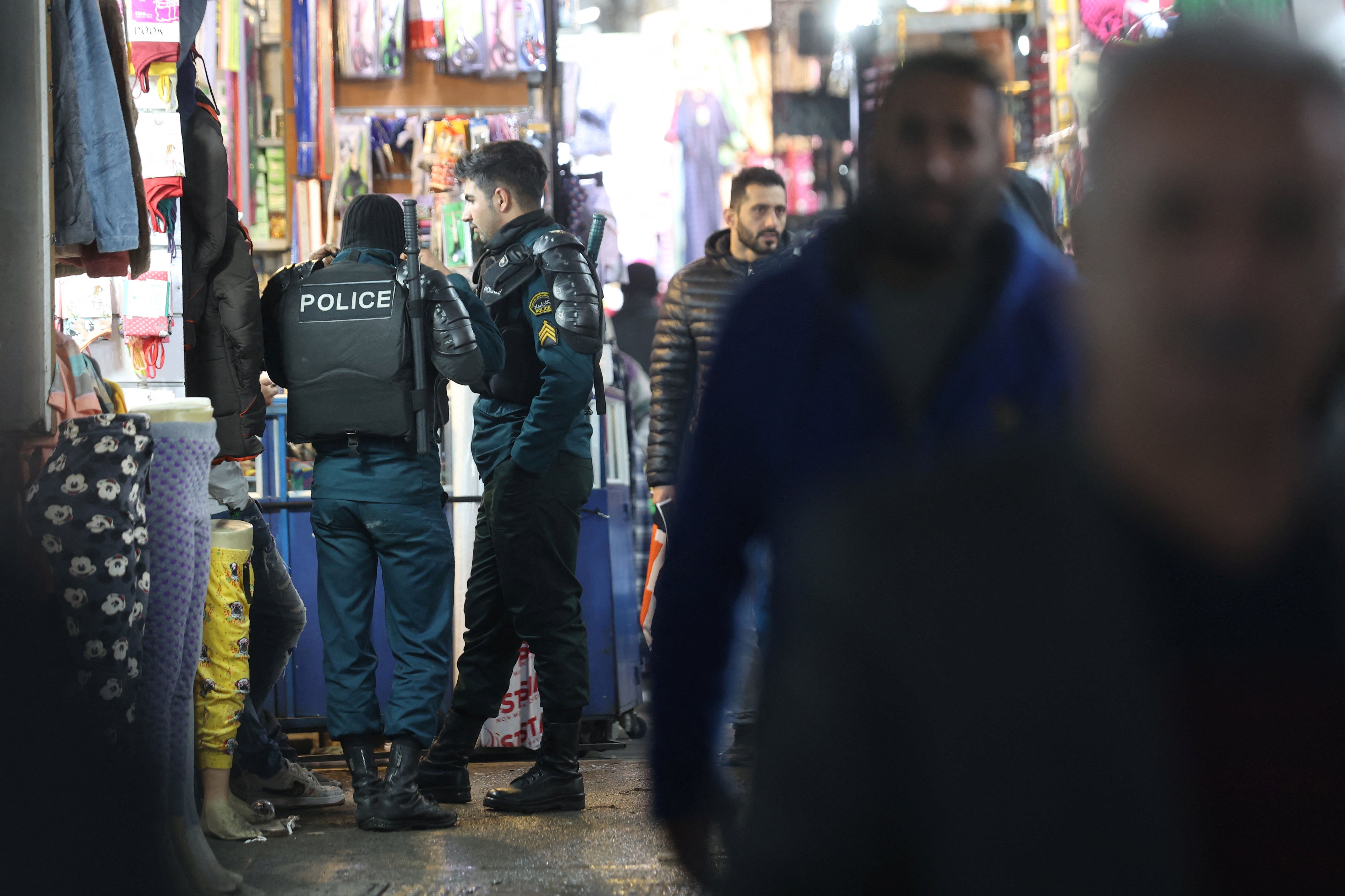 Iran's riot police forces stand in Tehran Bazaar