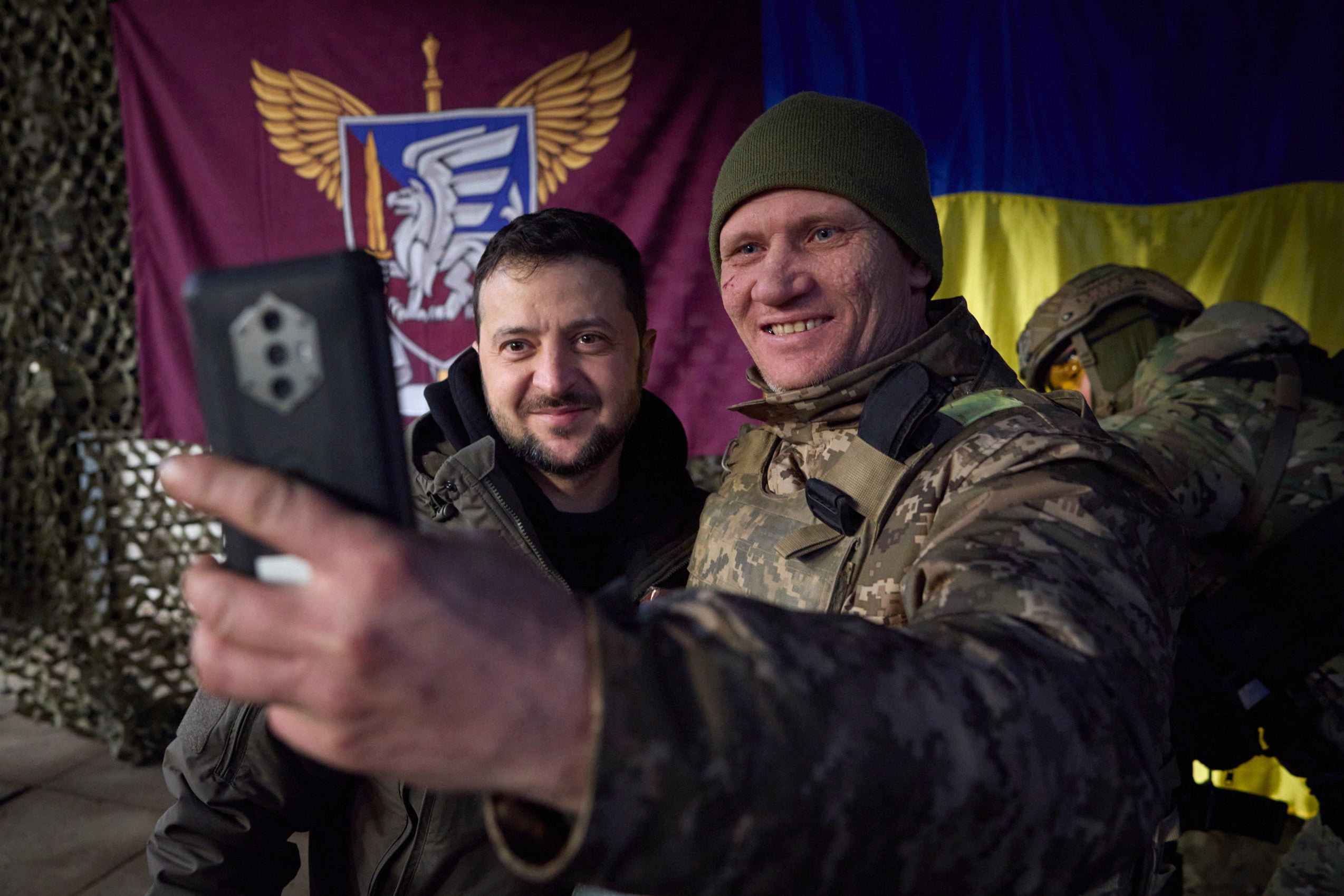 A Ukrainian soldier takes a selfie with President Zelensky during his visit to Sloviansk, Donbas on Tuesday