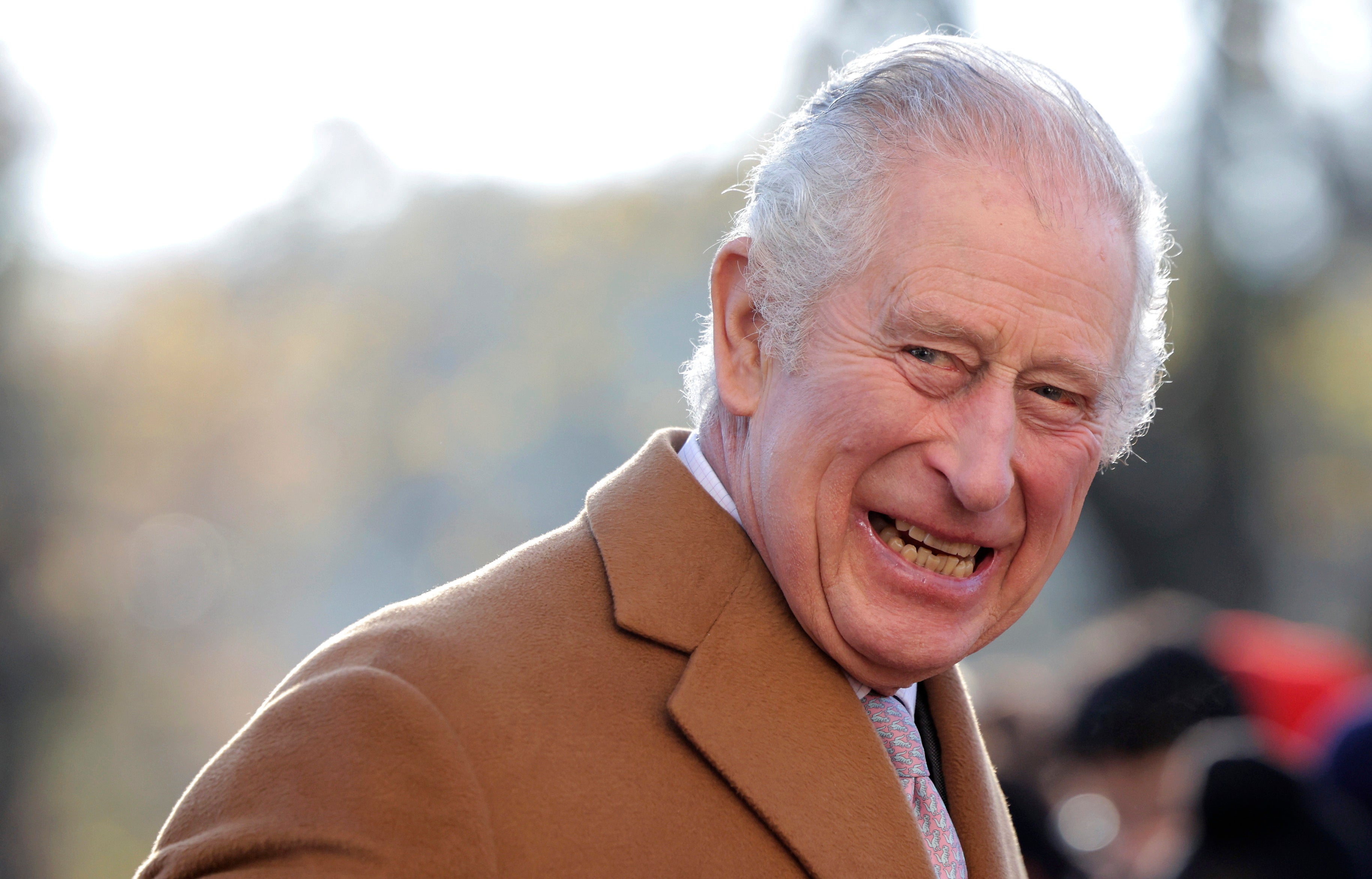 King Charles III smiles during a visit to the newly built Guru Nanak Gurdwara, in Luton, on Tuesday, 6 December