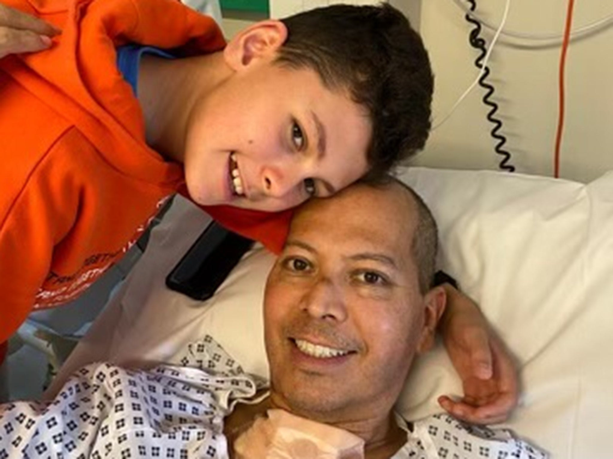 Cesar Franco, 50, with son Gabriel after the surgery