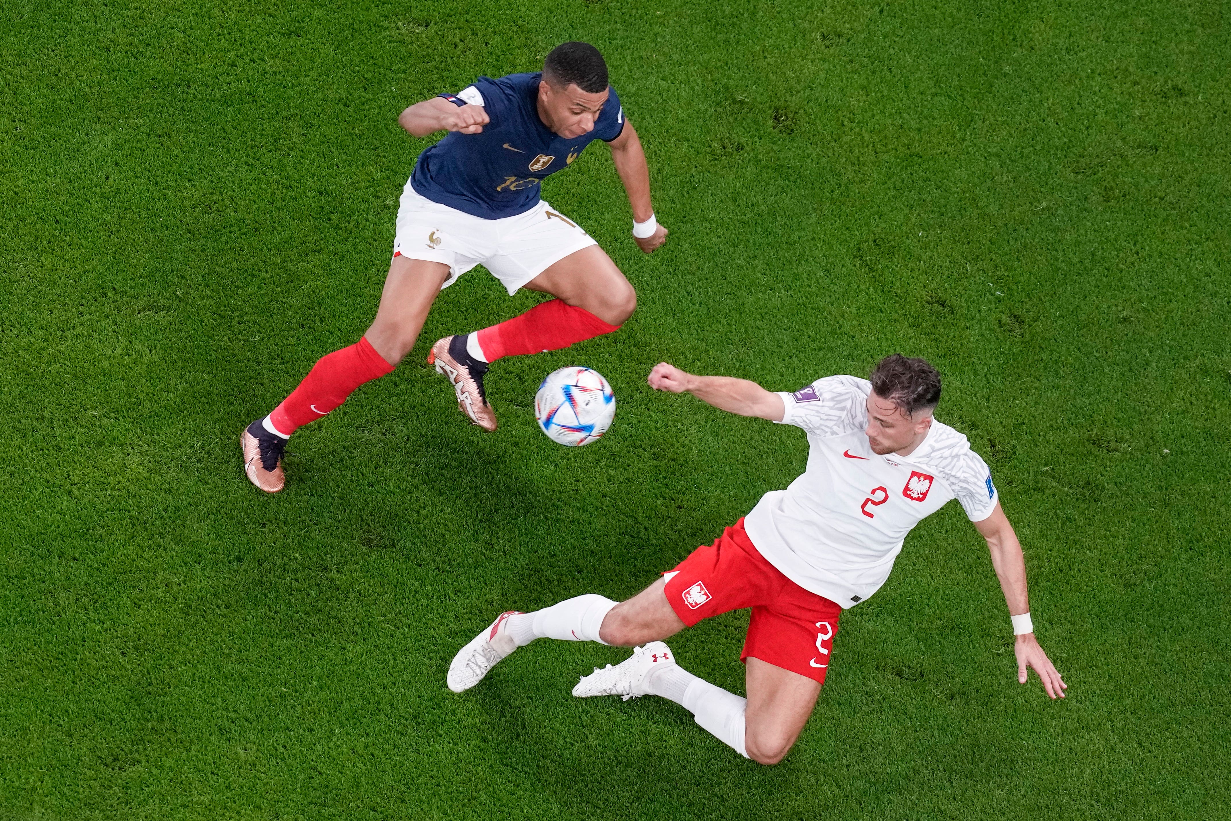 Kylian Mbappe gave Matty Cash the run-around in France’s 3-1 win over Poland (Thanassis Stavrakis/AP)