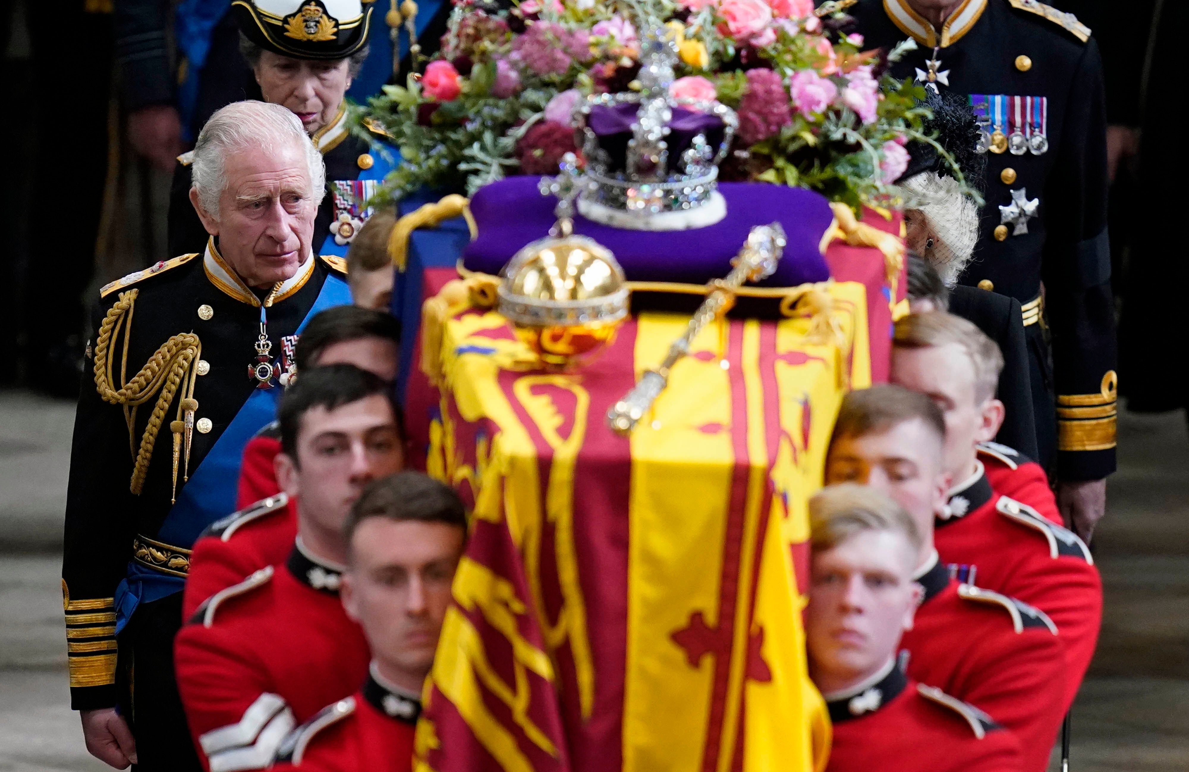 Charles alongside his mother’s coffin after she passed away earlier this year