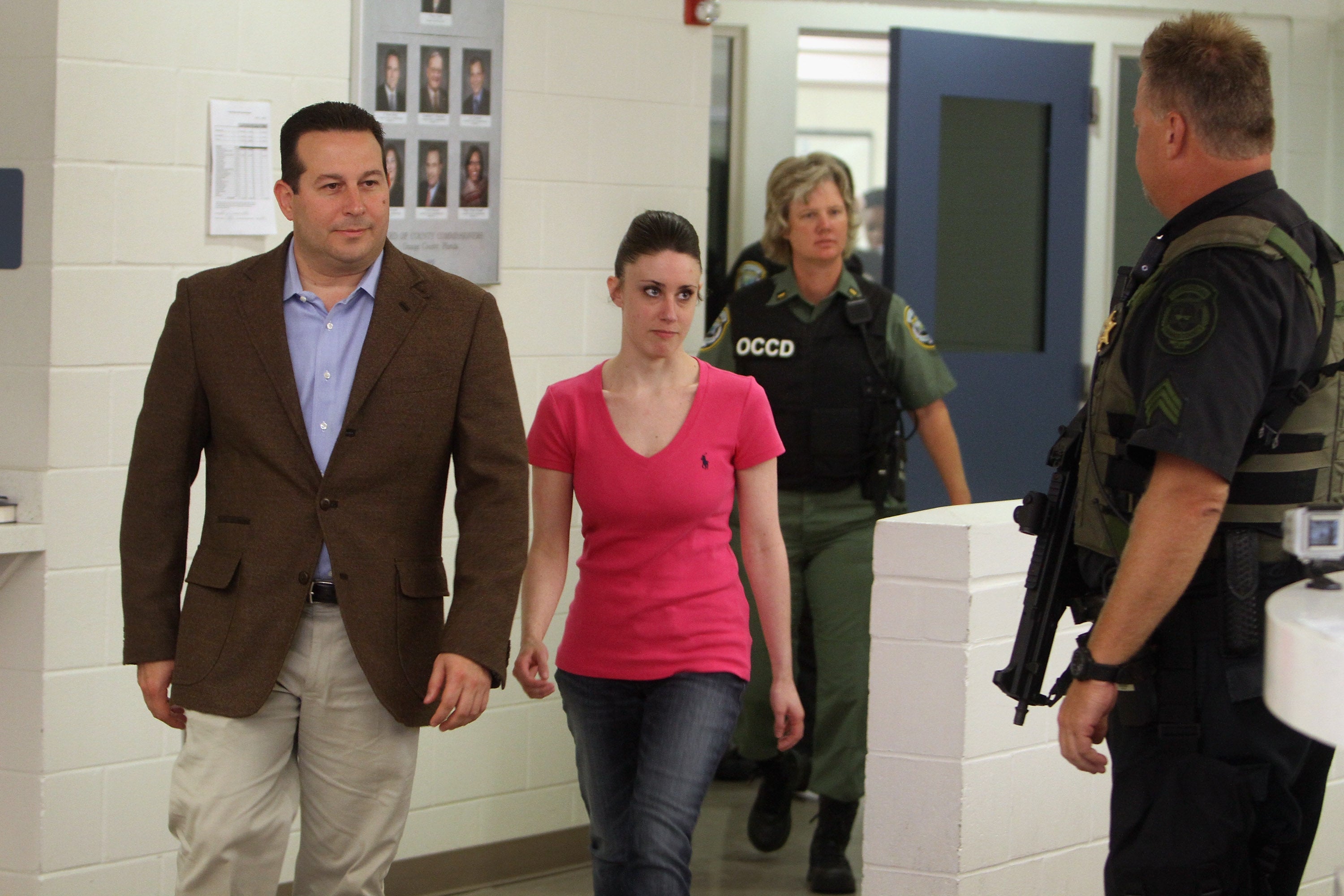 Casey Anthony (C) leaves with her attorney Jose Baez (L) from the Booking and Release Center at the Orange County Jail after she was acquitted of murdering her daughter Caylee Anthony on July 17, 2011 in Orlando, Florida.