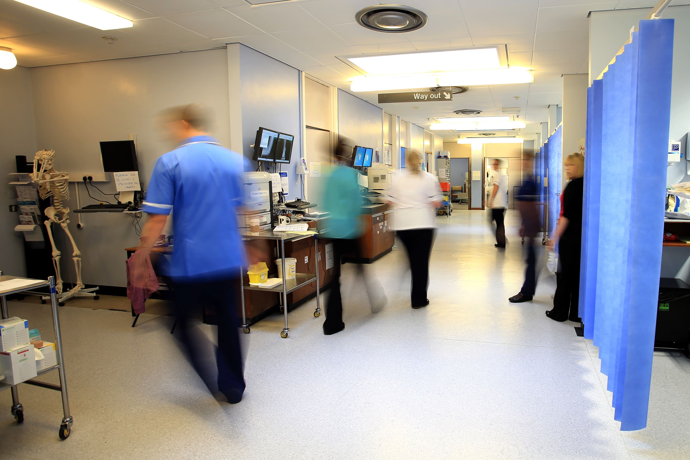 File photo dated 03/10/14 of staff on a NHS hospital ward. New waiting times data shows there are 7.2m people waiting for treatment. PA.