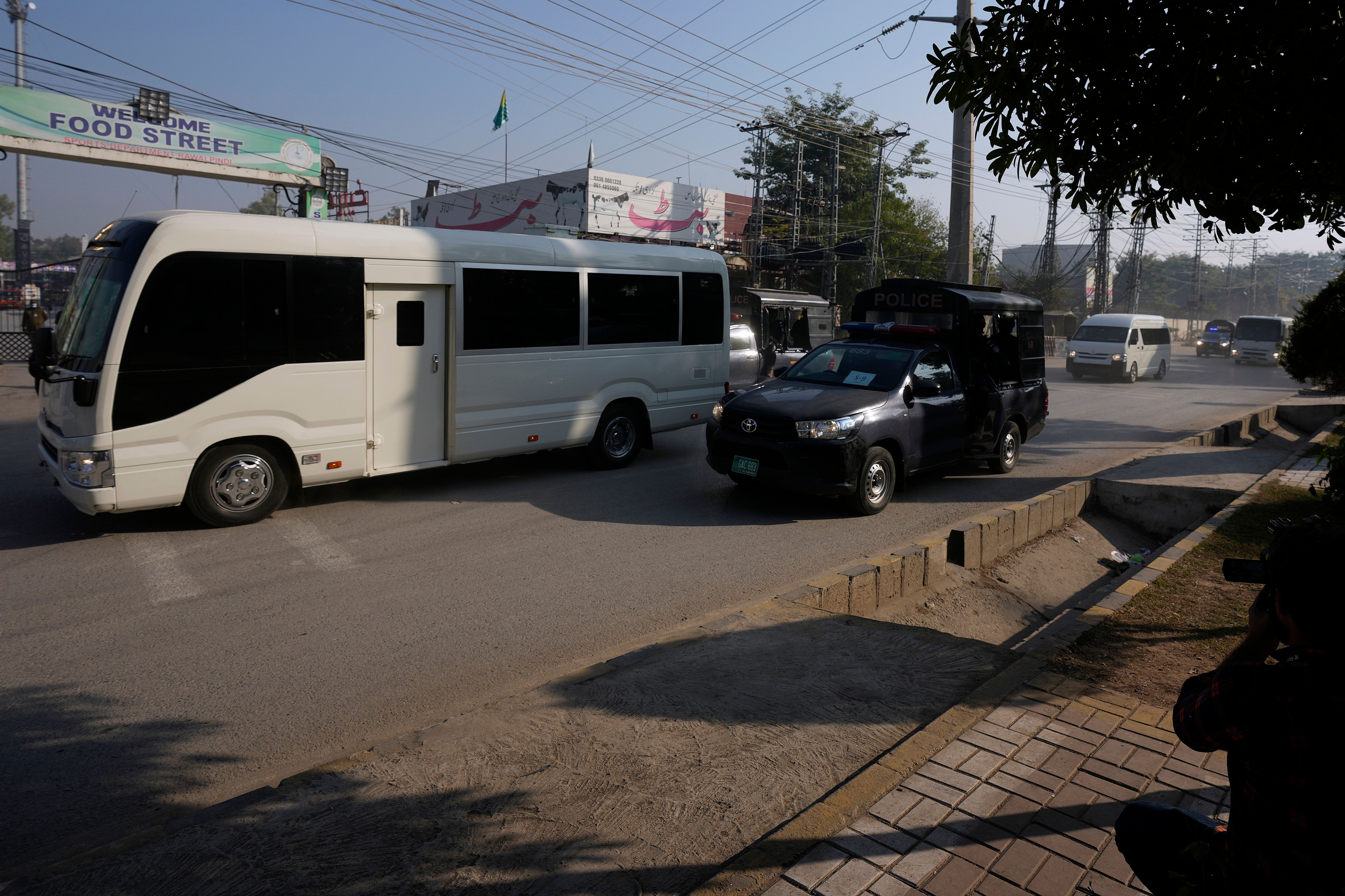 A convoy of security vehicles are escorting the England cricket team during their three-Test series in Pakistan (Anjum Naveed-AP)