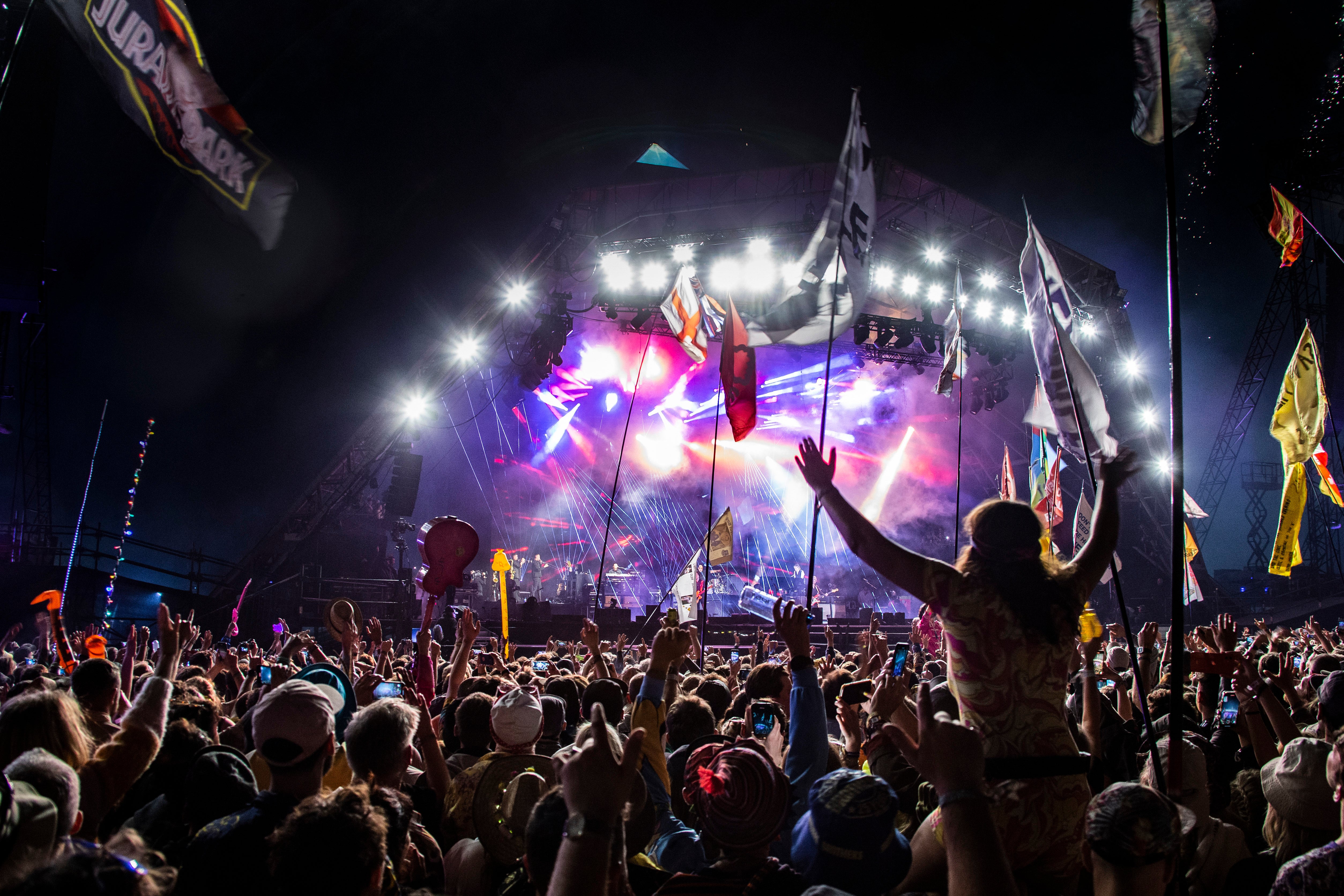 Festival goers watch Paul McCartney perform at Glastonbury Festival 2022