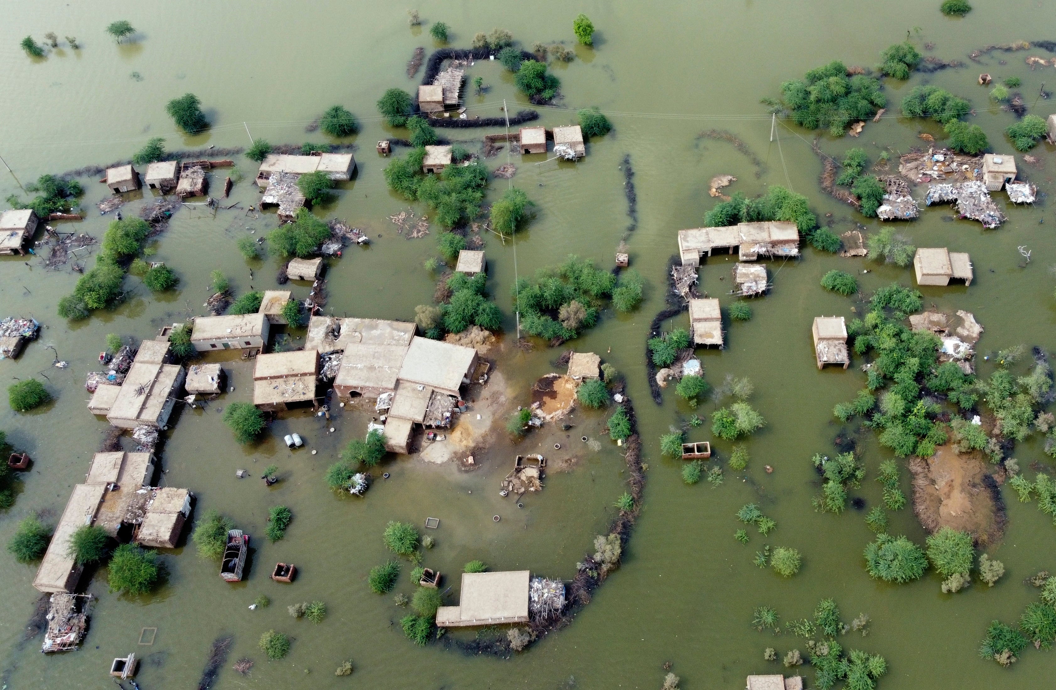 Homes are surrounded by floodwaters in Sohbat Pur city, Baluchistan