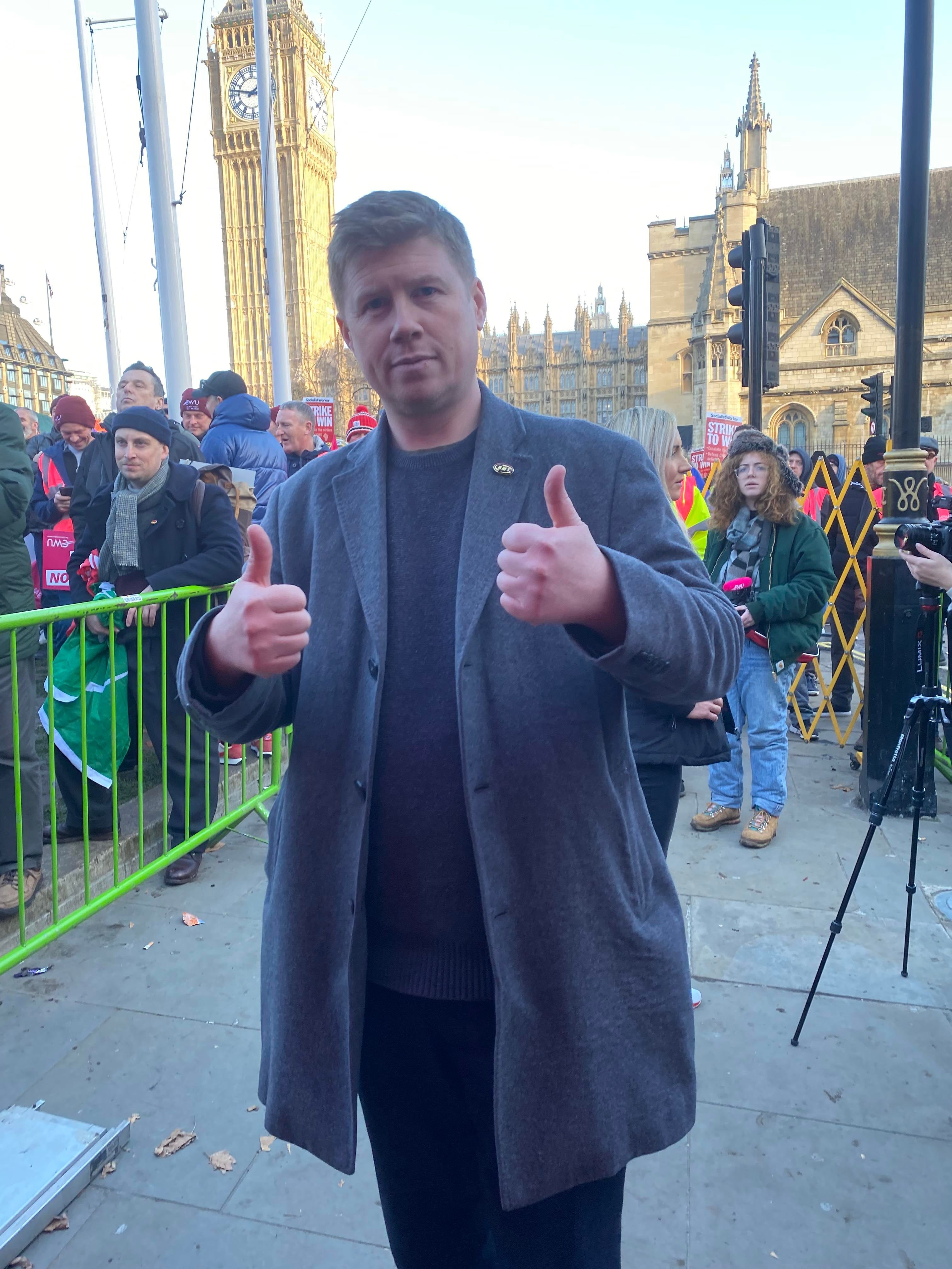 Eddie Dempsey shows support for striking postal workers at the Parliament Square rally.