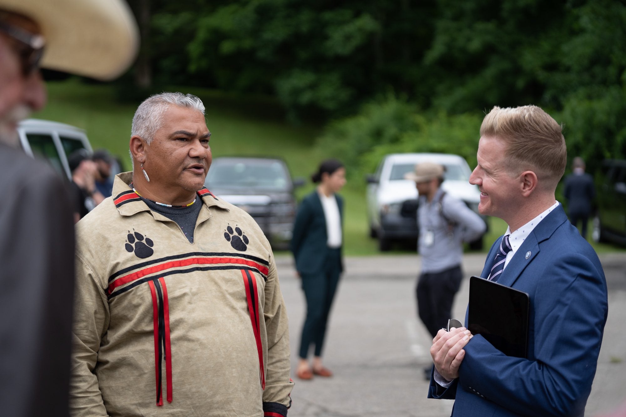 Chief Vincent Mann talks to Shawn LaTourette at a press conference to announce a new lawsuit against Ford.