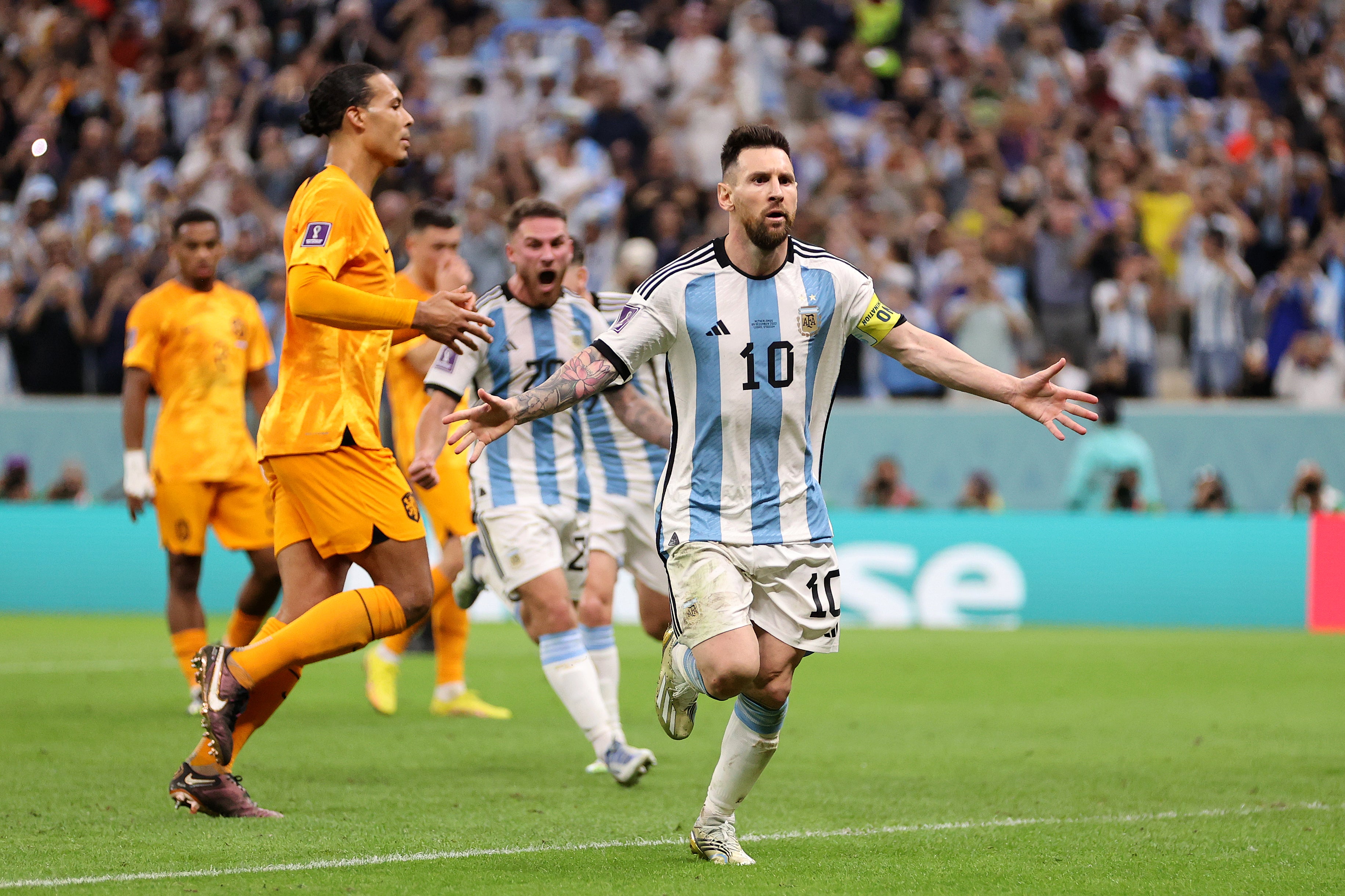 Lionel Messi celebrates scoring from the spot