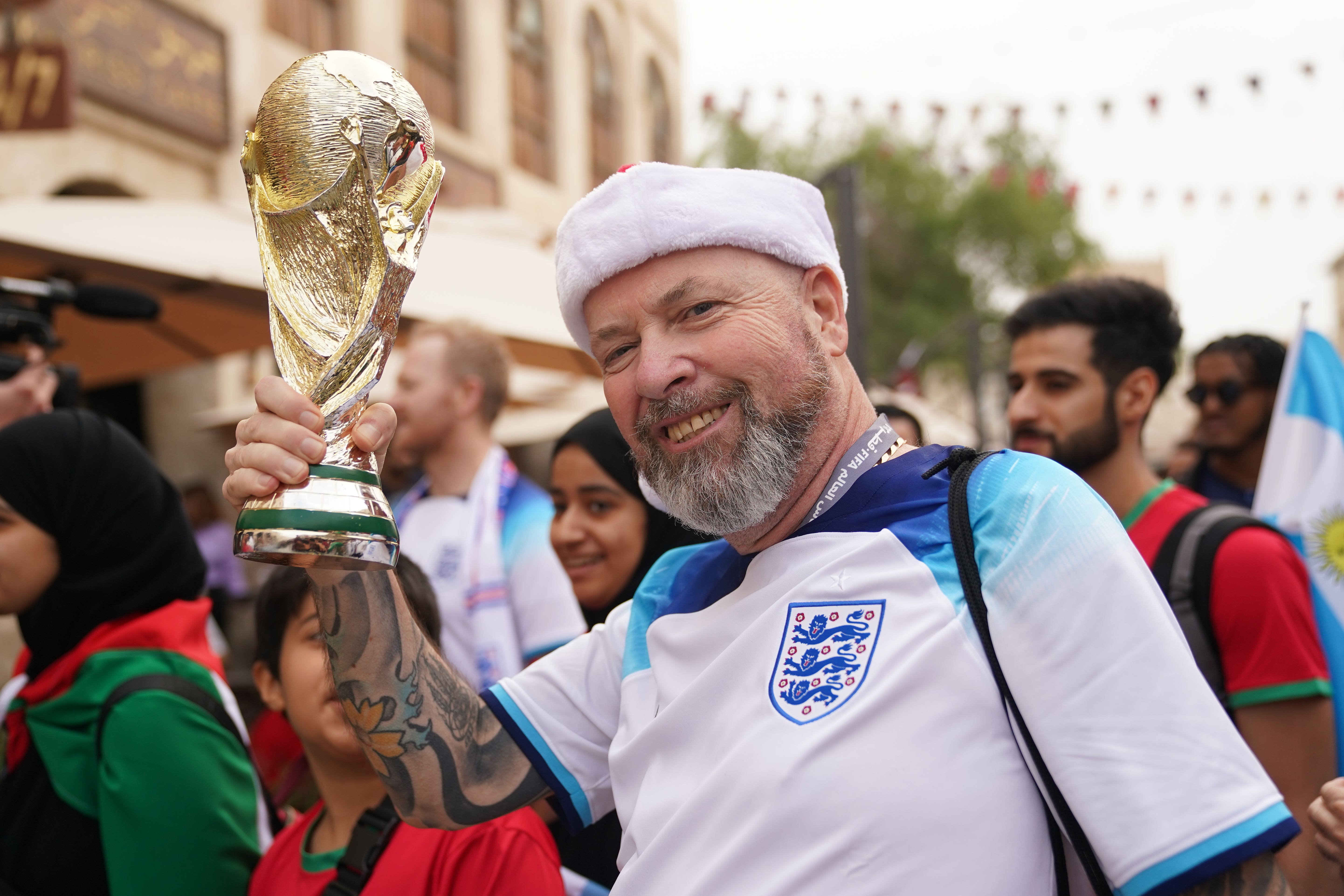 England fan Richard, with a replica of the World Cup in Souq Waqif before the Fifa World Cup quarter-final match at the Al Bayt Stadium in Al Khor, Qatar (Adam Davy/PA)