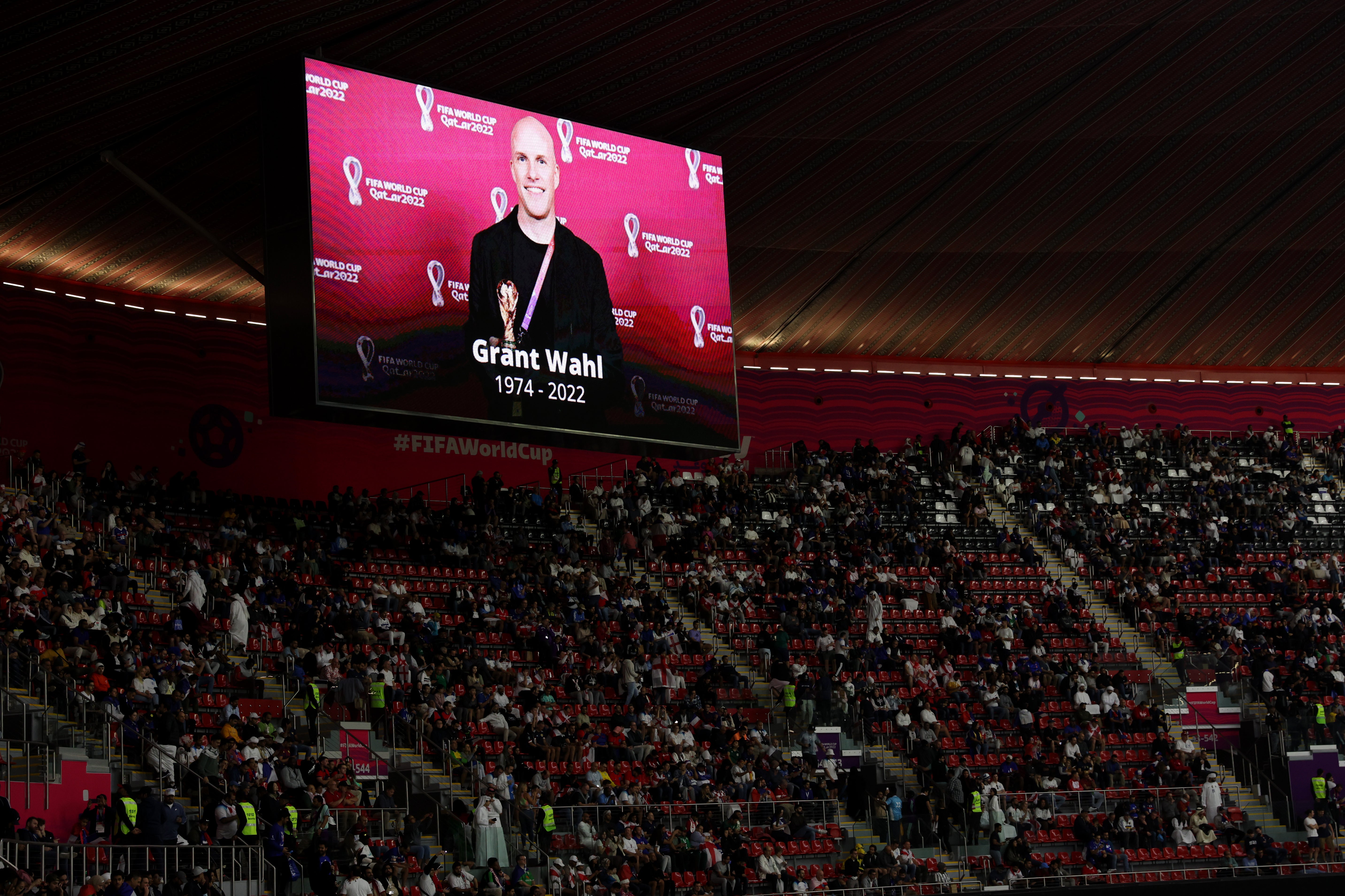 The LED board shows a photo of of Grant Wahl, an American sports journalist who passed away whilst reporting on the Argentina and Netherlands match