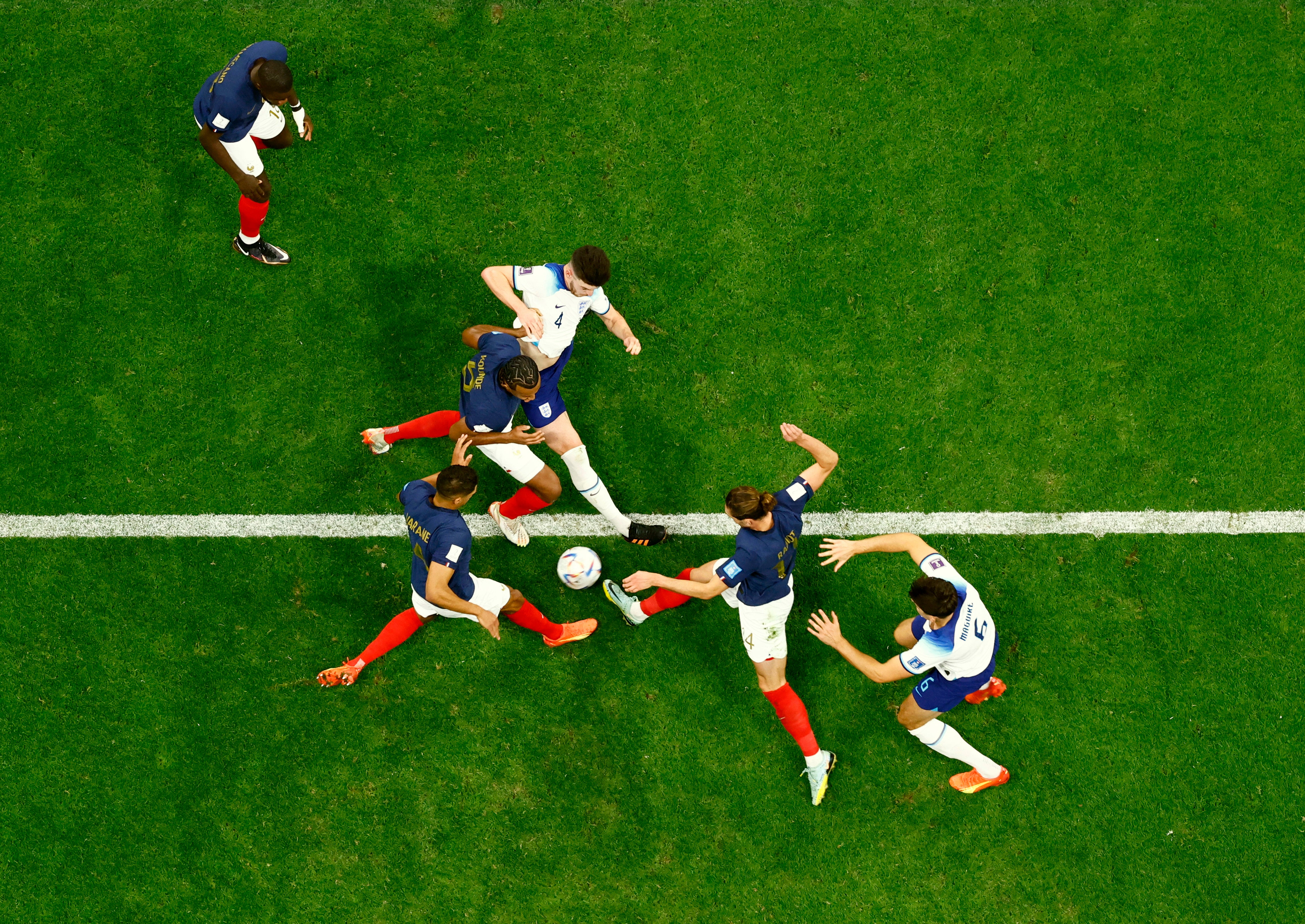 England's Declan Rice and Harry Maguire in action with France's Jules Kounde, Adrien Rabiot and Raphael Varane