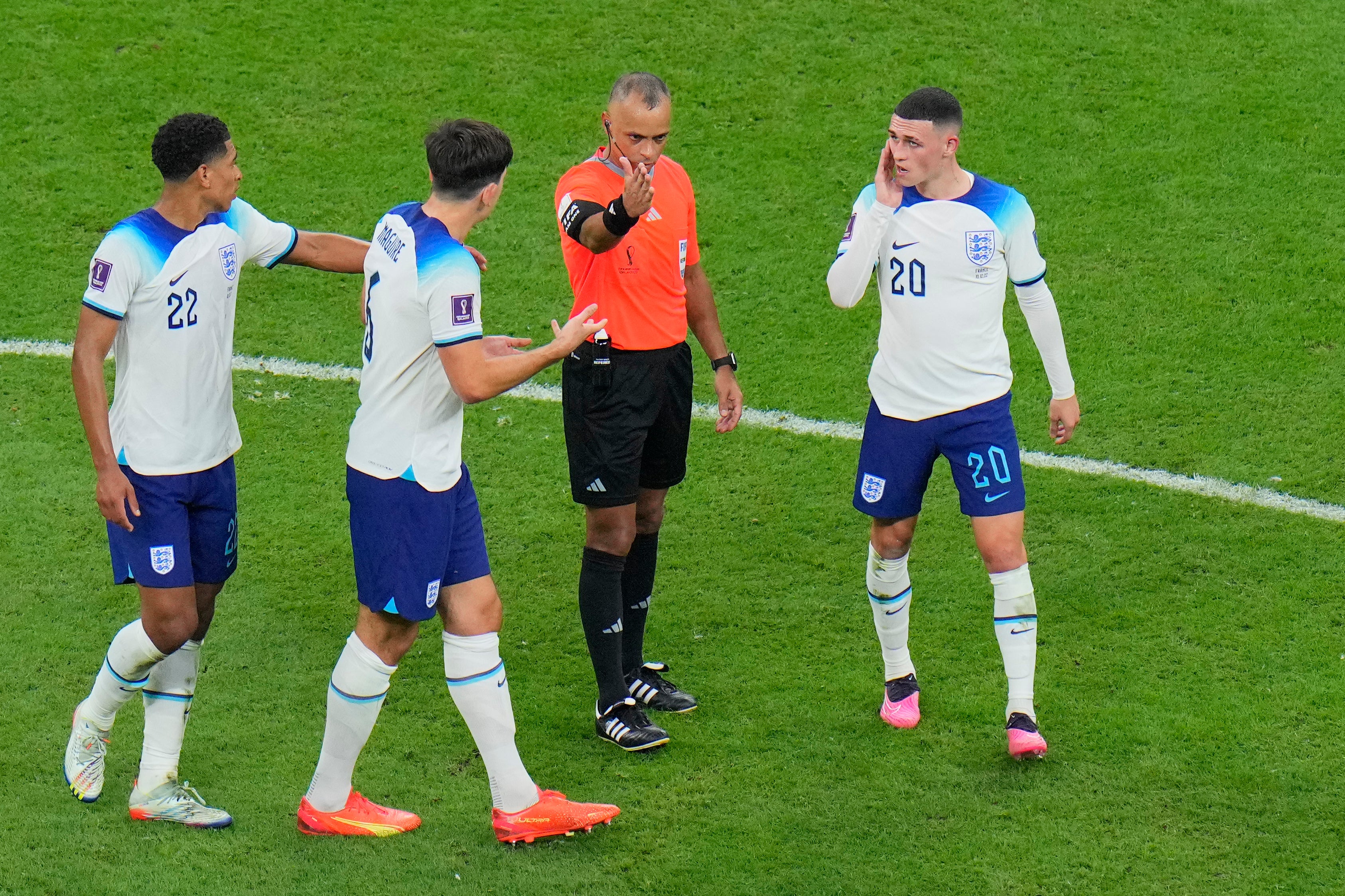 England players argue with referee Wilton Pereira Sampaio