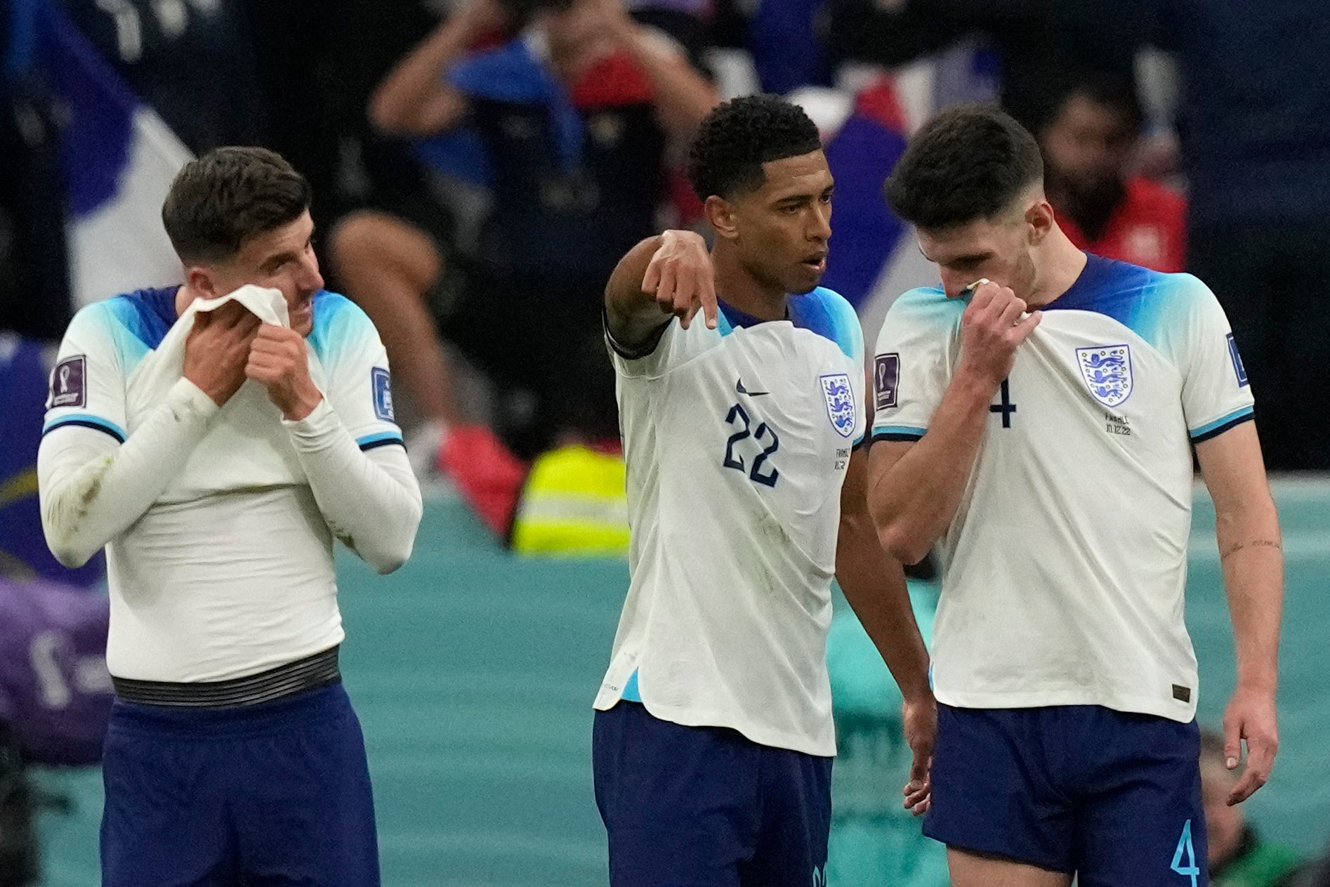 From left, England’s Mason Mount, Jude Bellingham and Declan Rice react after World Cup defeat