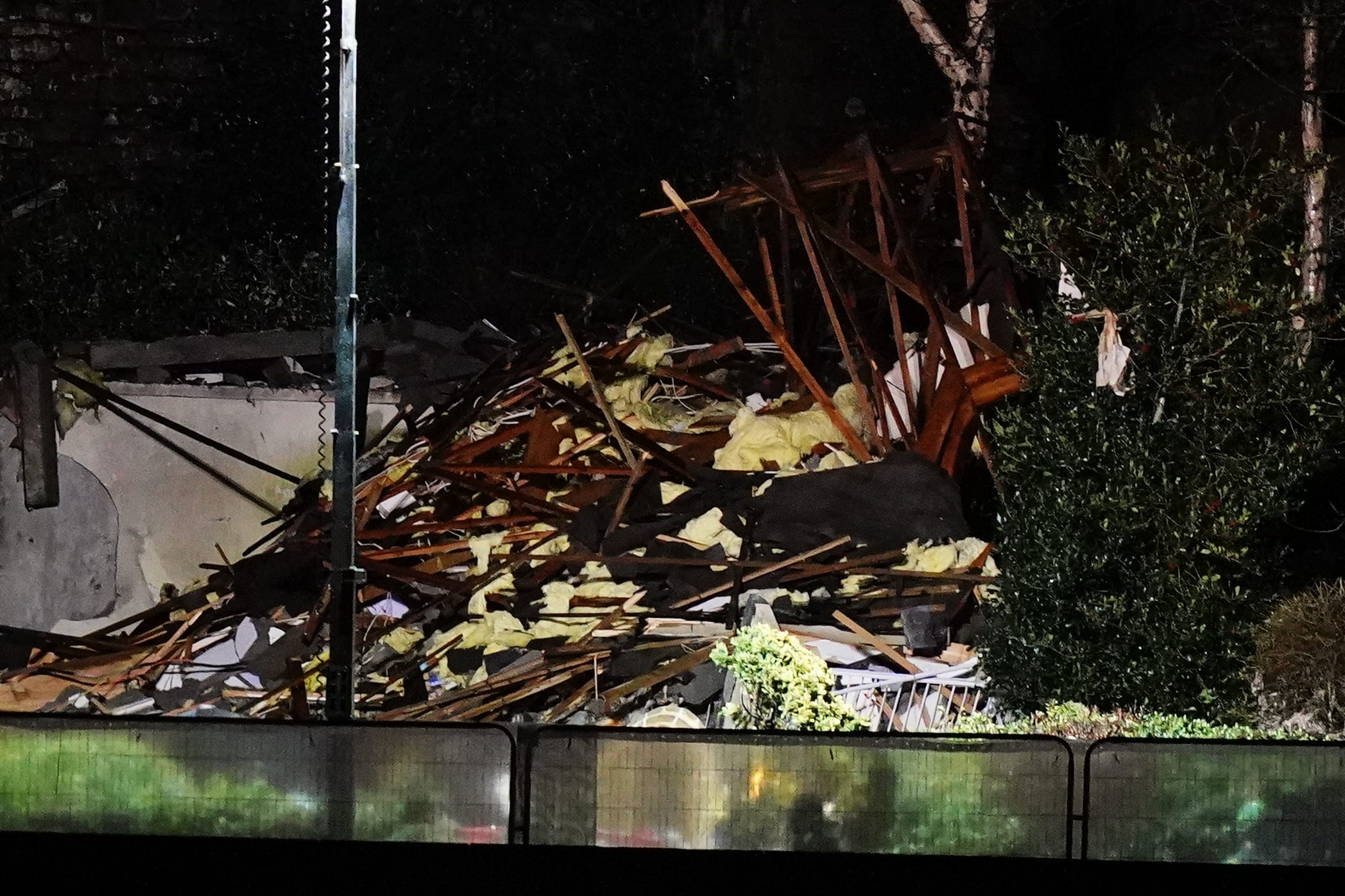 Emergency personnel at the scene of an explosion and fire at a block of flats in St Helier, Jersey