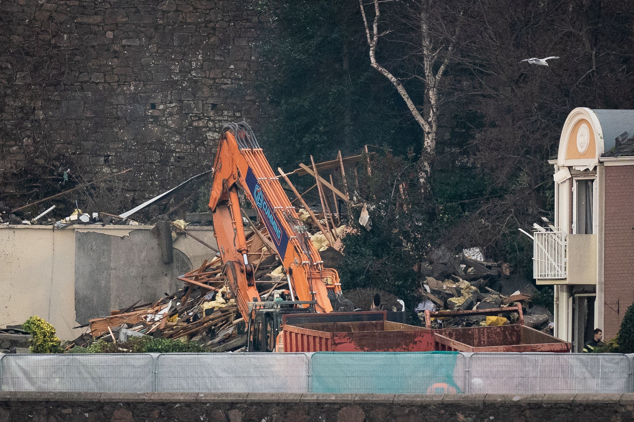 At least three people have died and a dozen others are missing after an explosion in St Helier, Jersey