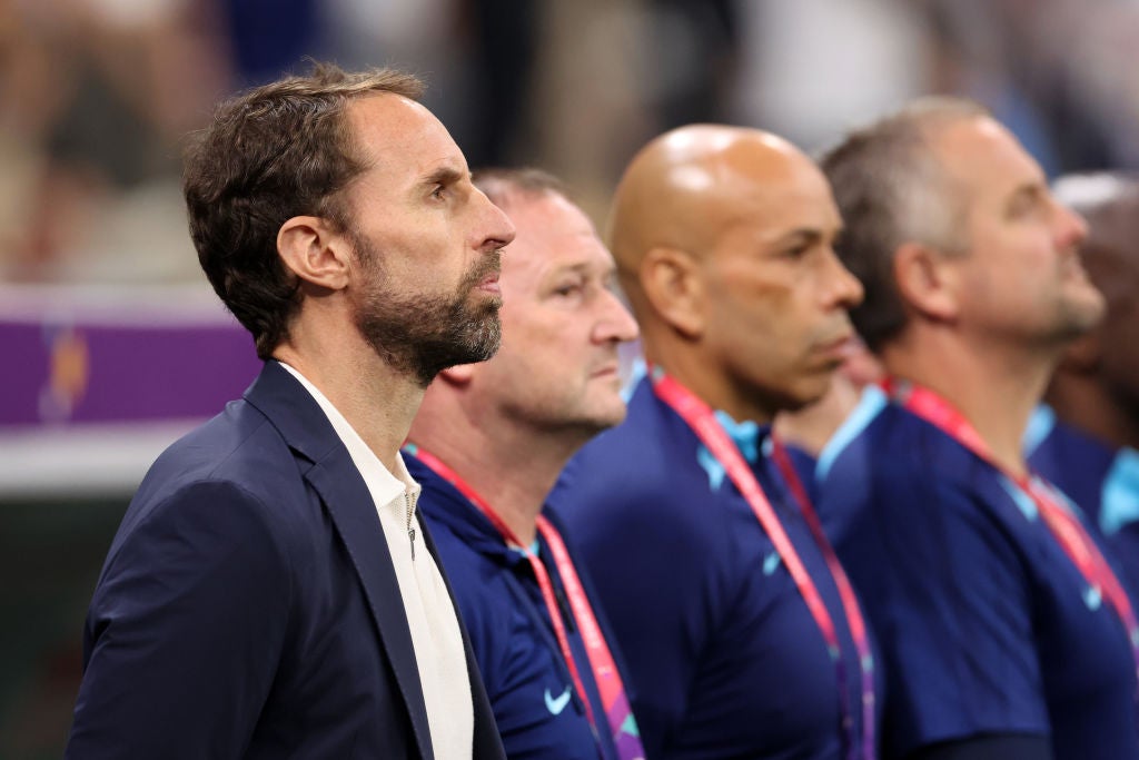 England’s coaching staff look impassive before the opening whistle