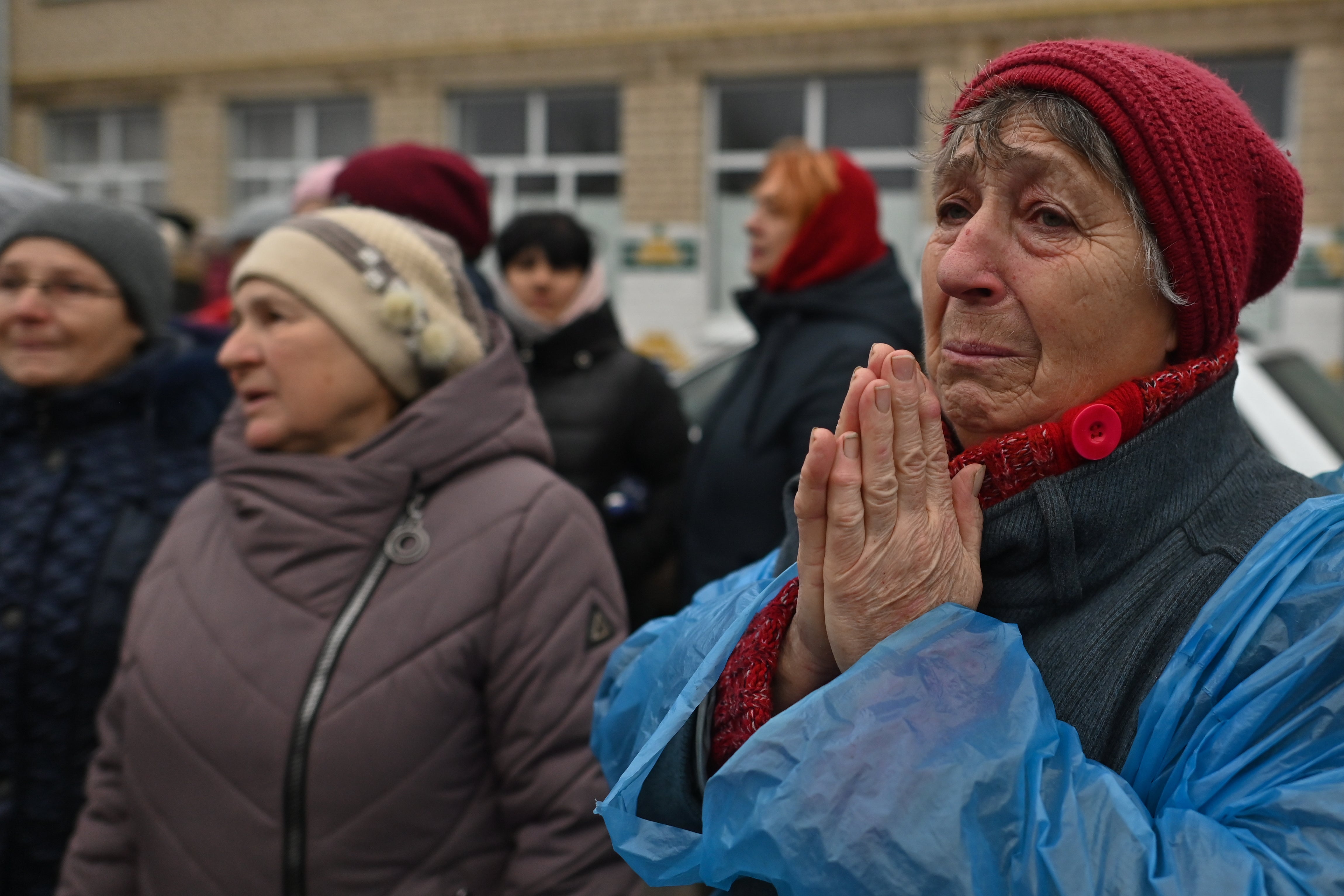 A women from the village of Daryivka near Kherson after receiving food and clothing from Polish aid workers