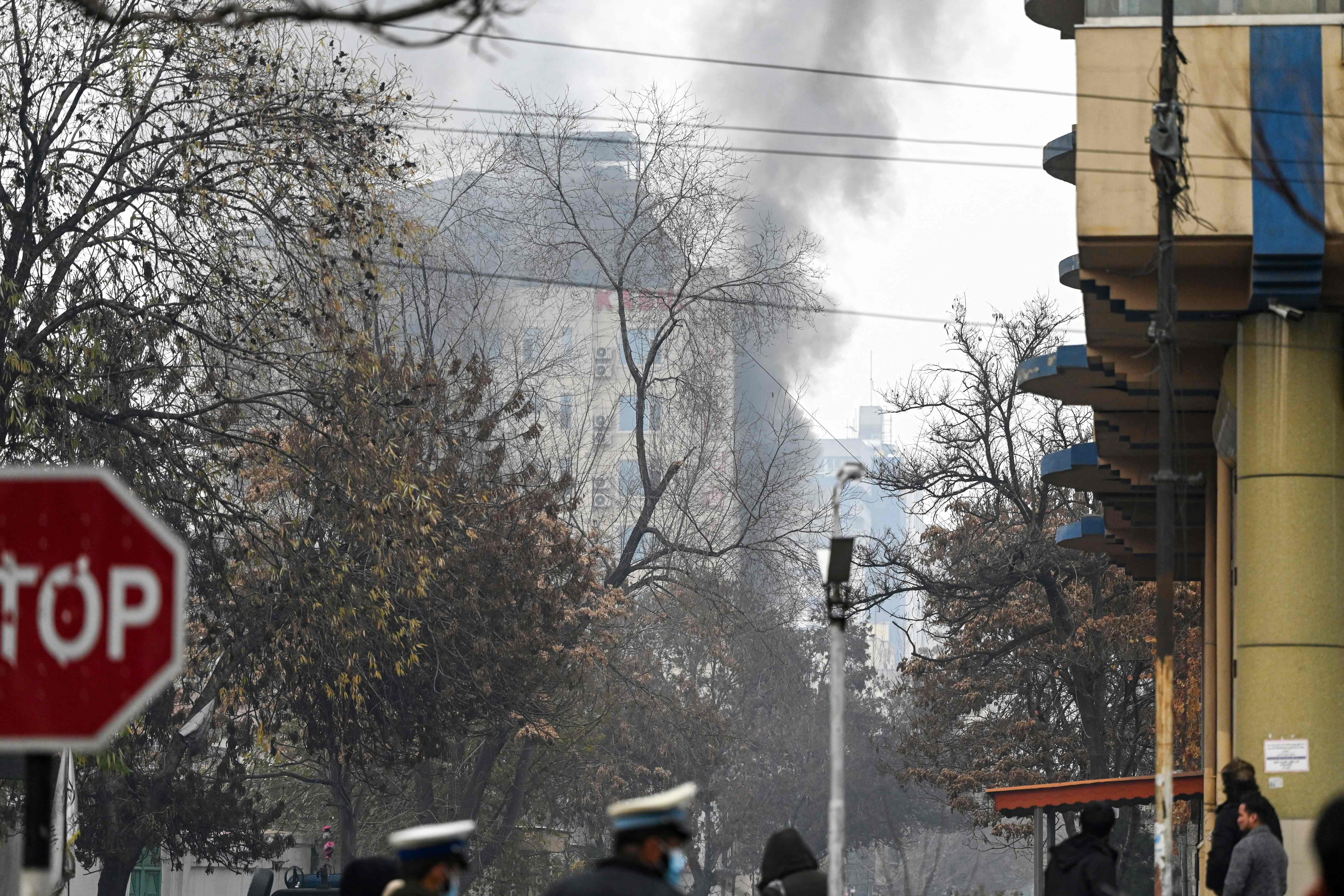 Smoke rises from the site of the attack at Shahr-e-naw, one of Kabul’s main commercial areas