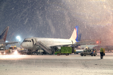 ‘Disgraceful’: Kids sleep on airport floor as flights delayed by snow