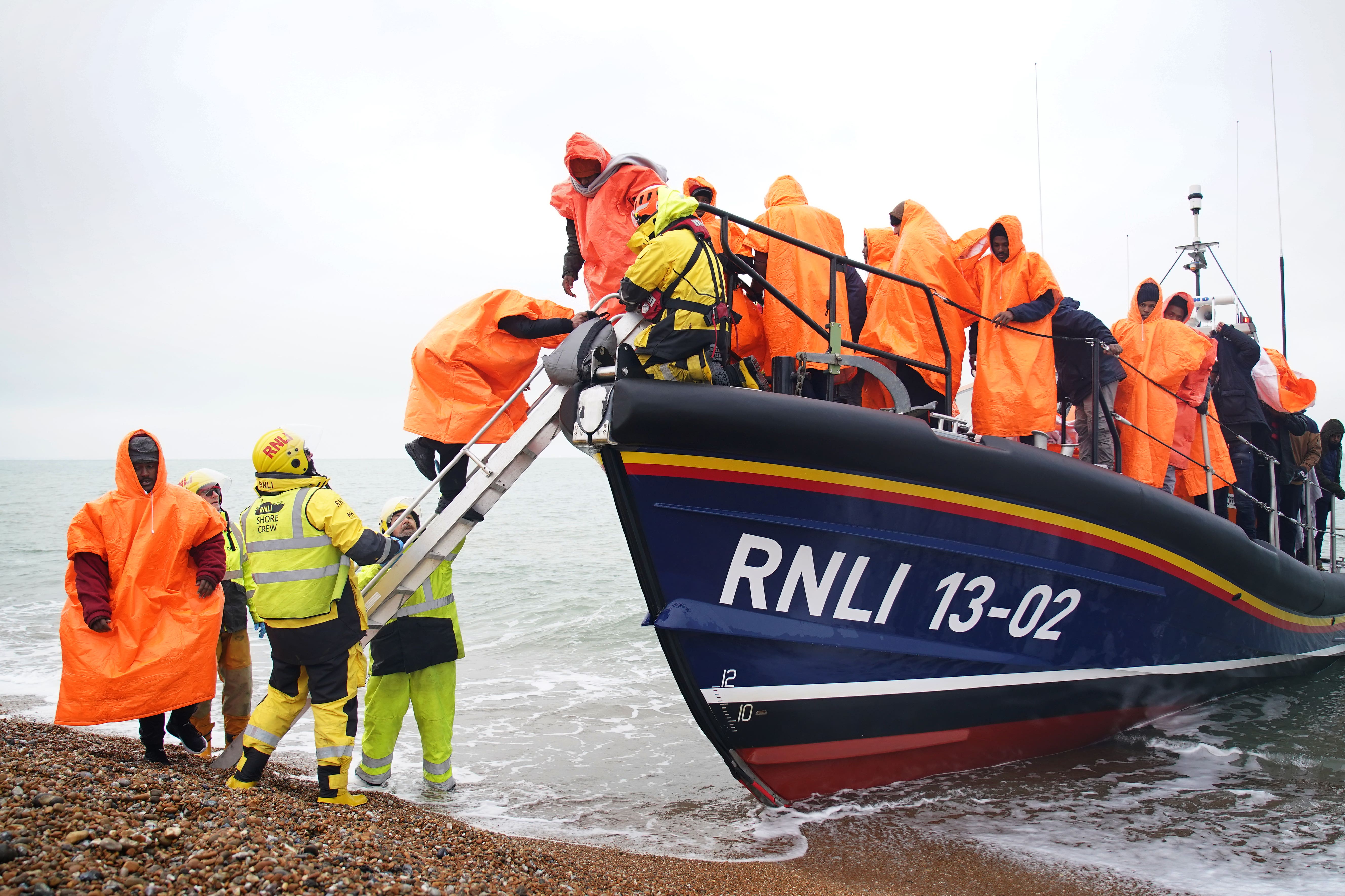 A group of people thought to be migrants are brought in to Dungeness, Kent (Gareth Fuller/PA)