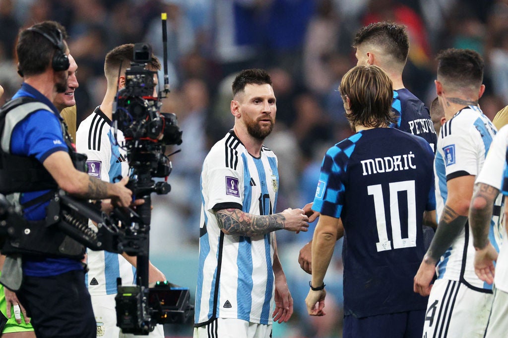 Messi commiserates with Modric at the final whistle as Argentina progress to the final