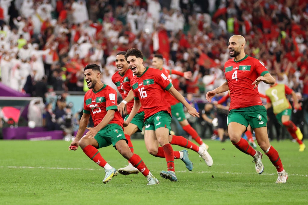 Morocco players celebrate after victory over Spain in a penalty shoot-out