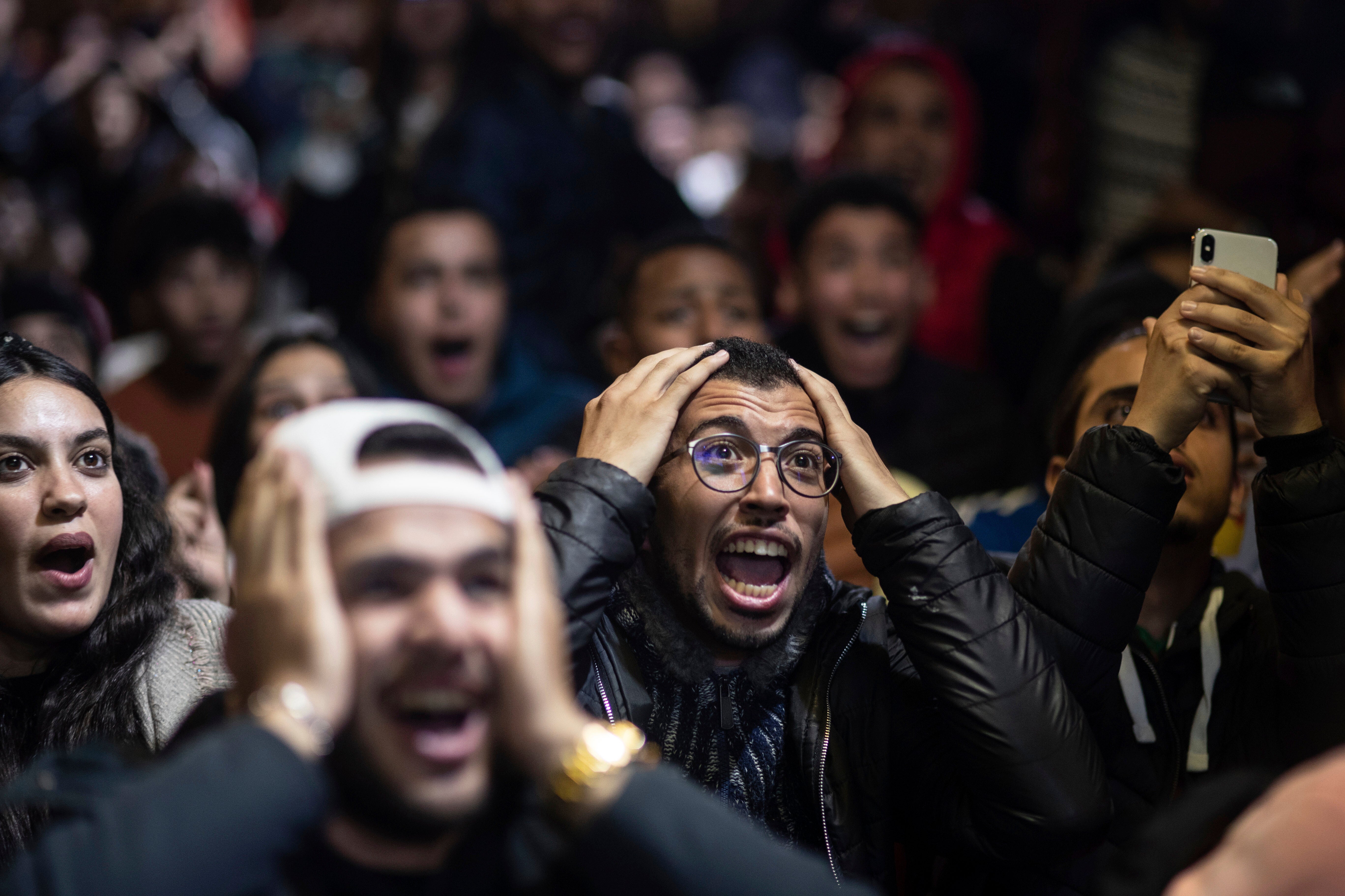 Moroccan fans react while watching the semi-final in Rabat