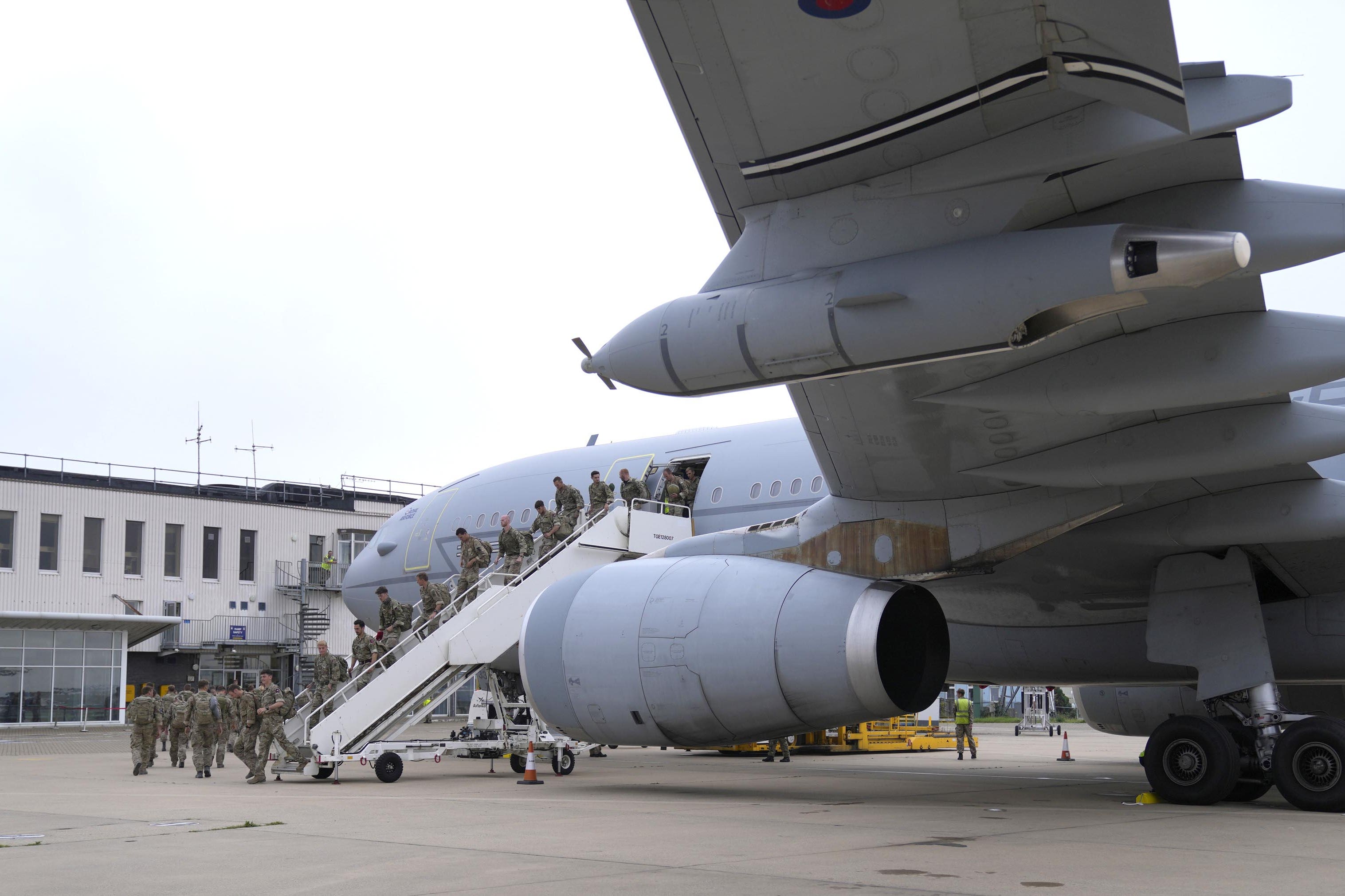 Members of the British armed forces 16 Air Assault Brigade disembark a RAF Voyager aircraft after landing at RAF Brize Norton, Oxfordshire, following their return from helping in operations to evacuate people from Kabul airport in Afghanistan in 2021 (Alastair Grant/PA)