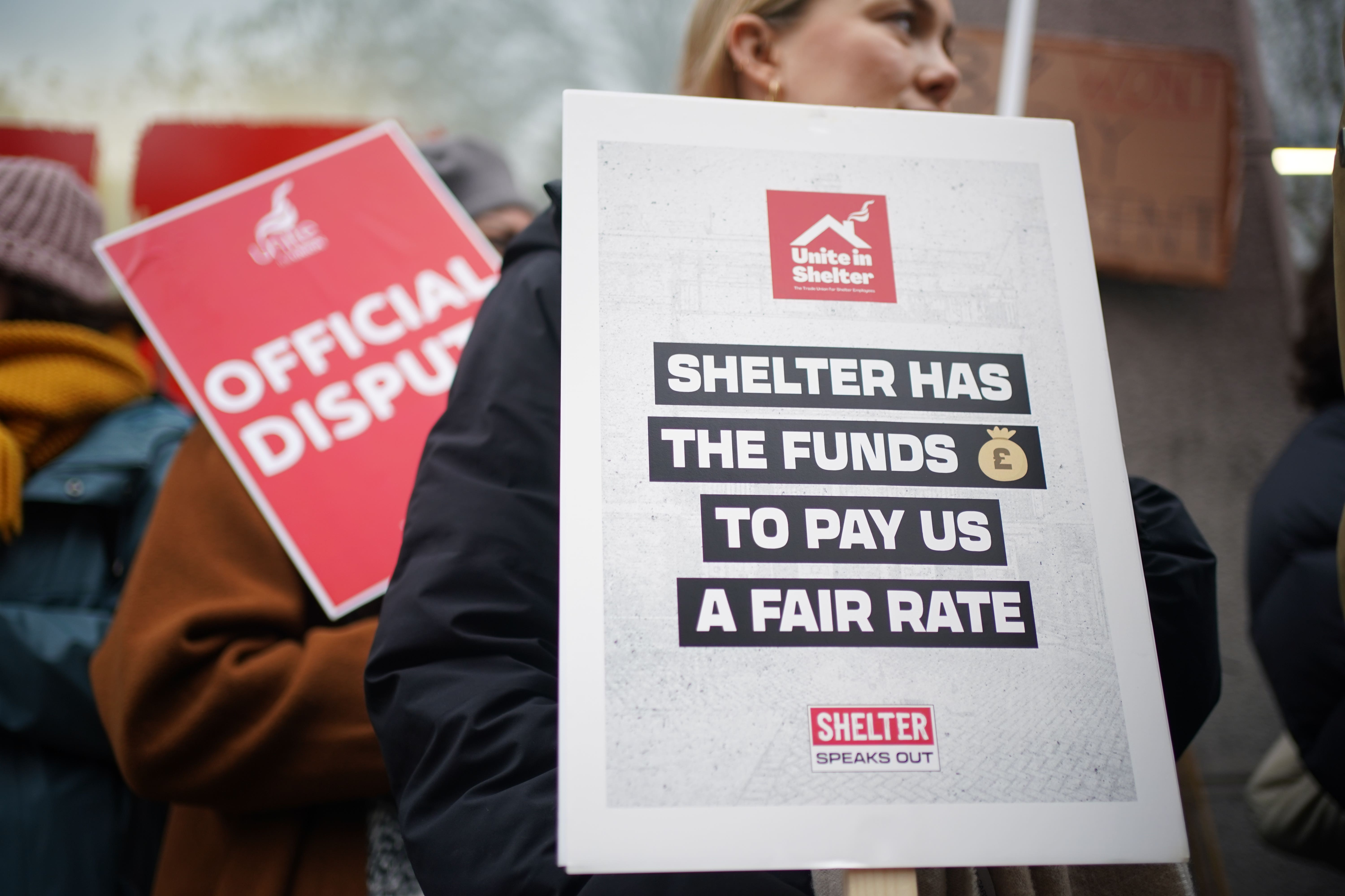 Members of the Unite union who work for housing and homeless charity Shelter on the picket line outside their offices in Old Street, London (Yui Mok/PA)