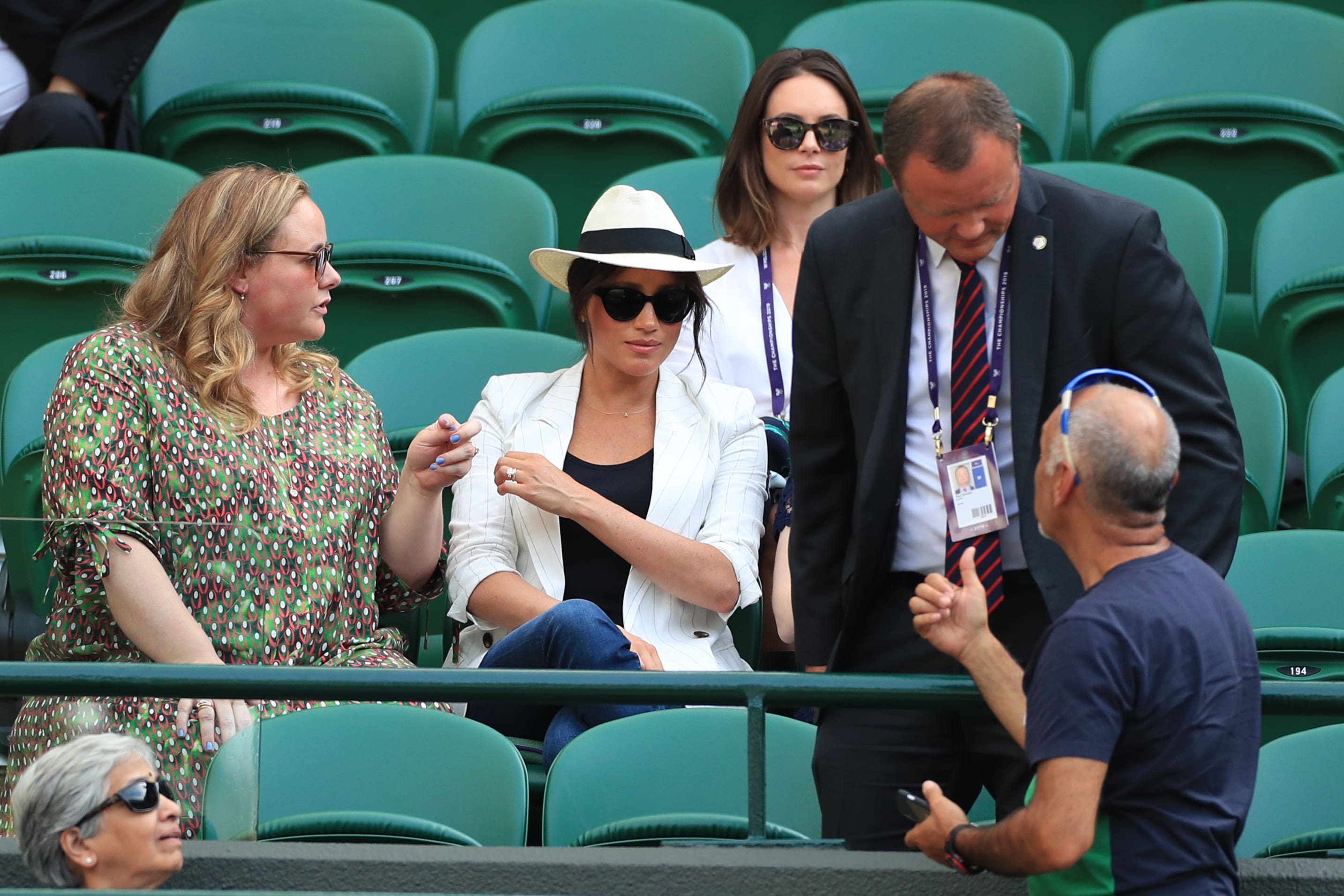 A man believed to be a Royal bodyguard speaking to a spectator who had taken a selfie as the Duchess of Sussex (Mike Egerton/PA)