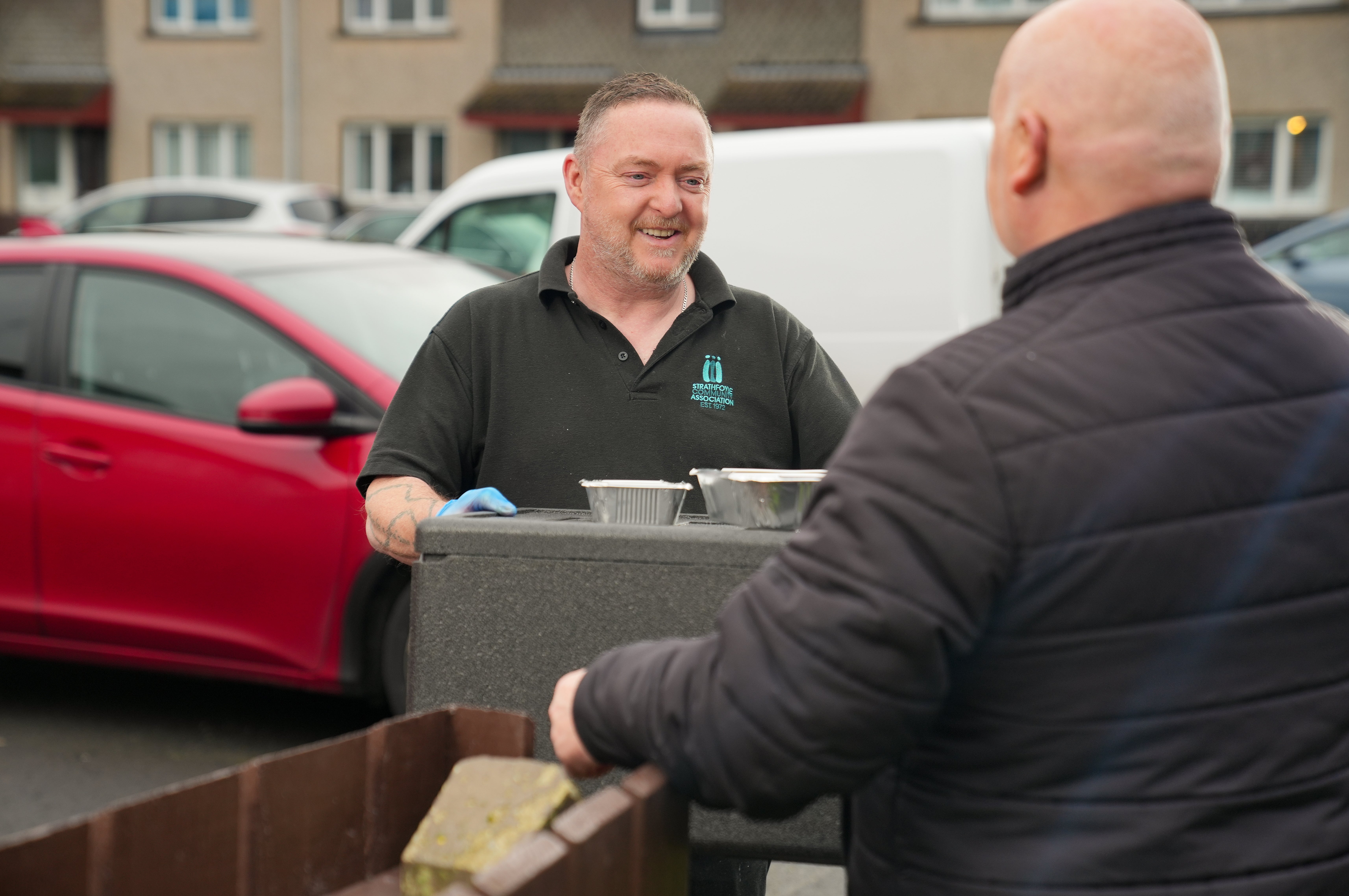 Project worker and chef Jeff Simpson delivering meals in the kitchen at Strathfoyle Community Association