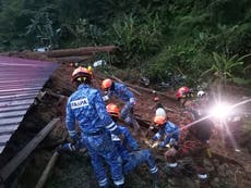 At least 12 killed and dozens feared trapped as Malaysia landslide sweeps through campsite