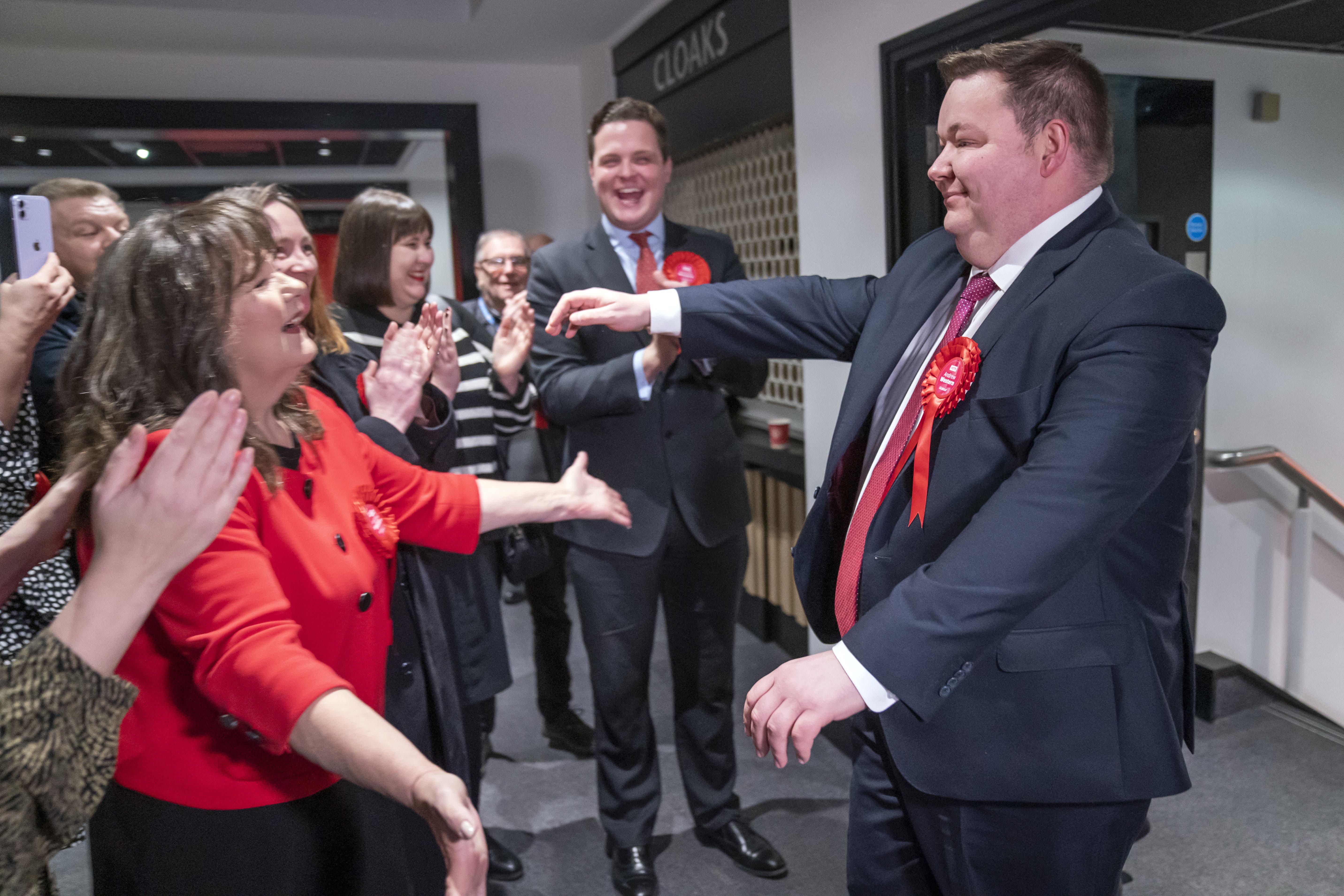 Andrew Western is greeted by party activists as he arrives at Old Trafford, for the votes to be counted in the Stretford and Urmston by-election (Danny Lawson/PA Wire)