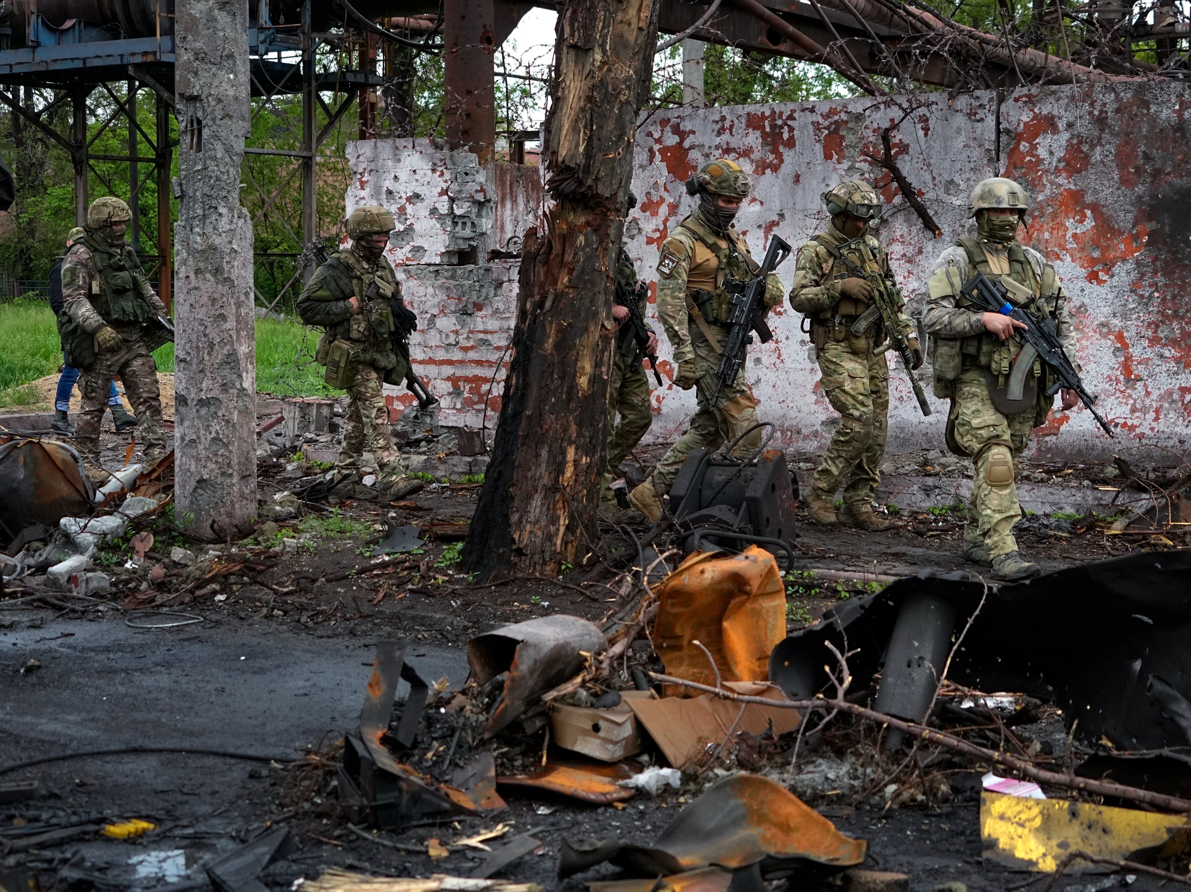 Russian troops, seen here in Mariupol in May, are also accused of planting devices in children’s toys