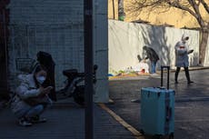 China Covid surge: Shanghai orders schools to close as funeral homes in Beijing struggle to catch up