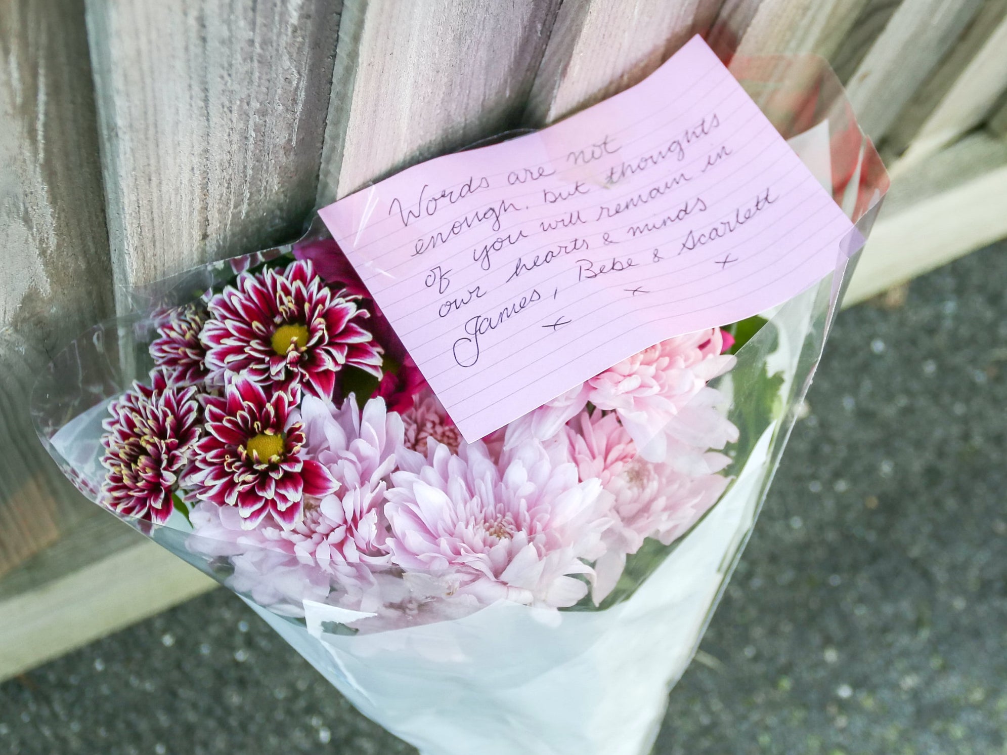 Tributes left at the scene after the triple tragedy