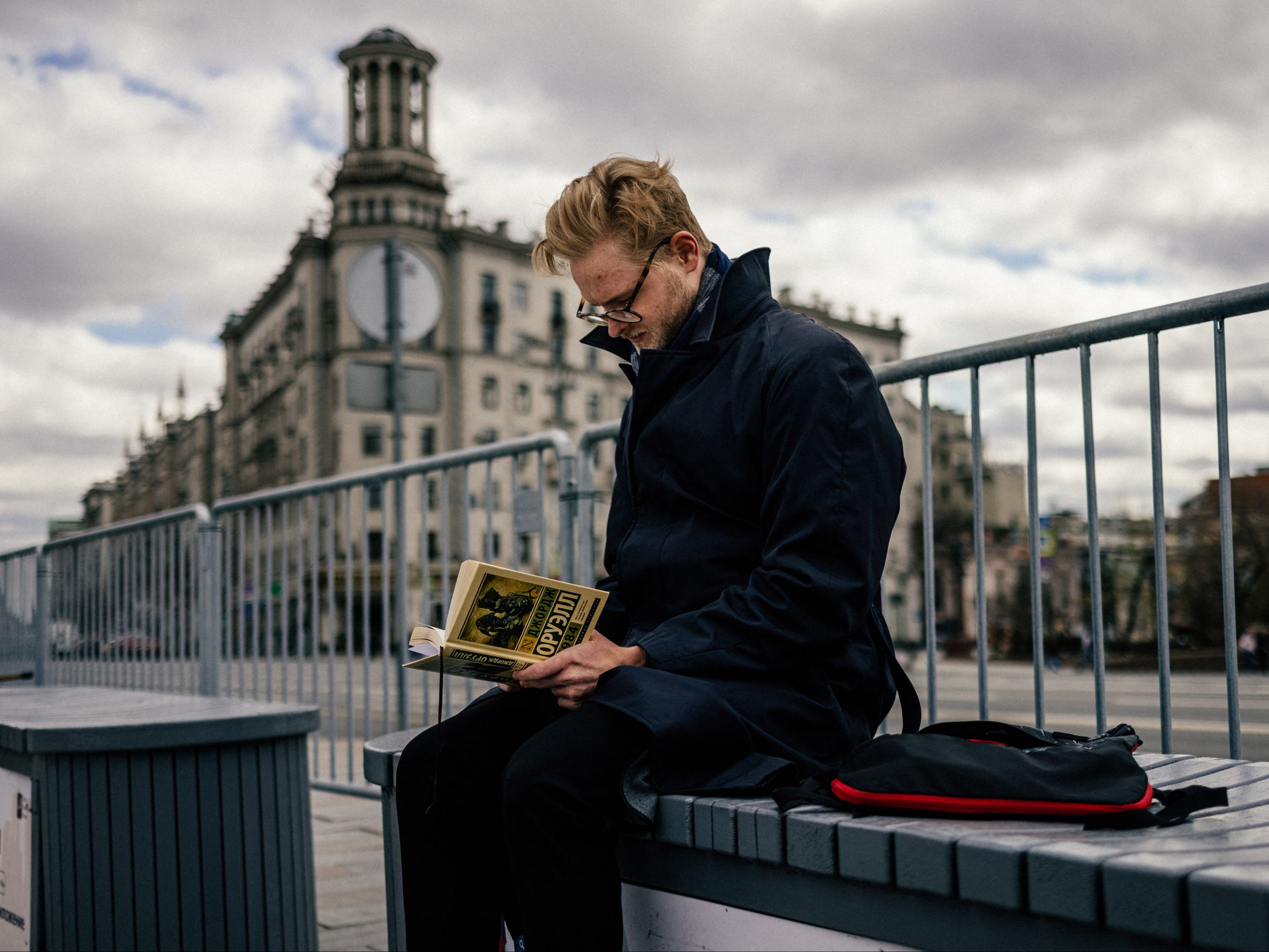 A man reads a Russian translation of George Orwell’s book 1984 at Moscow’s Pushkinskaya Square