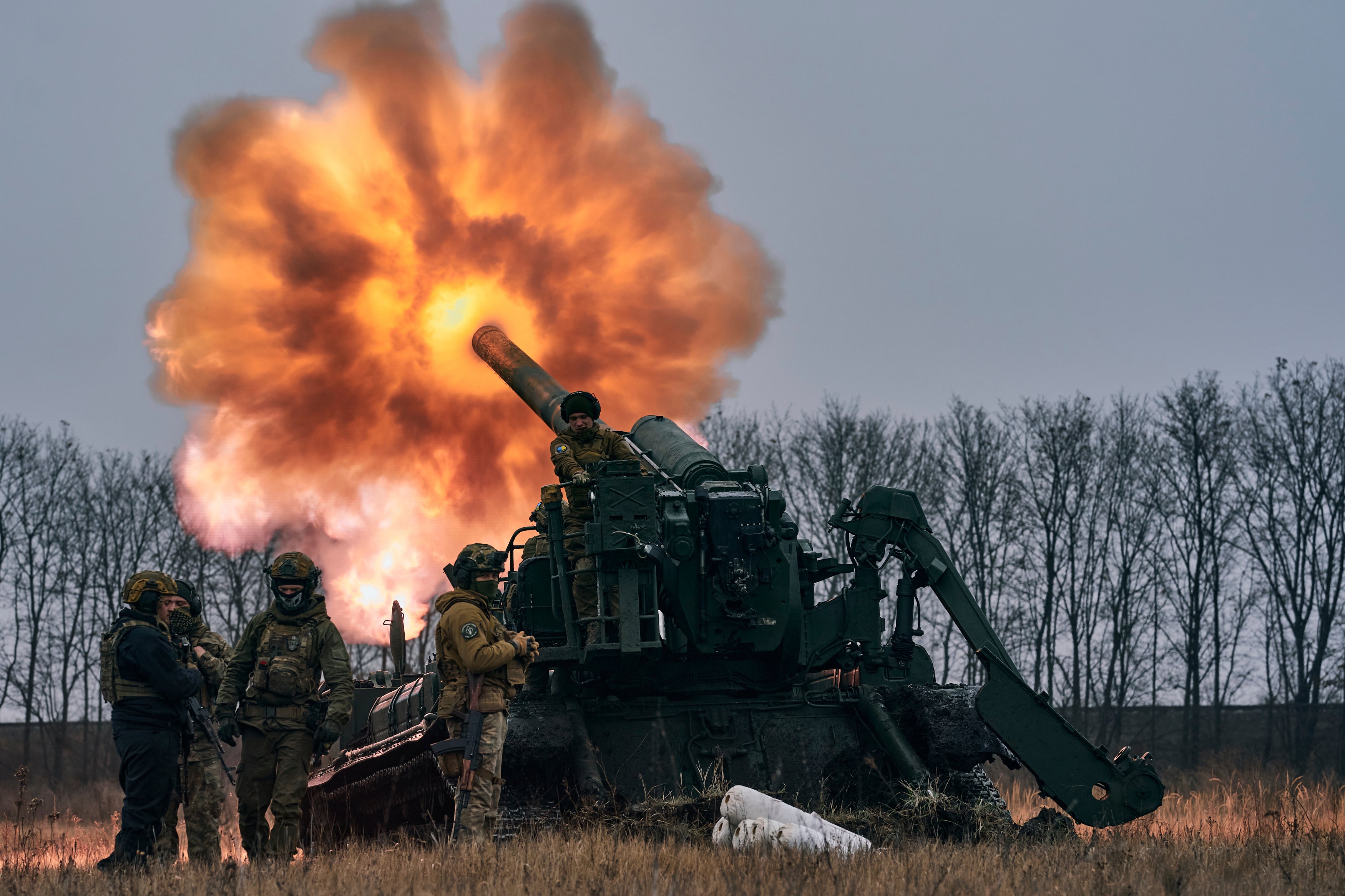 Ukrainian soldiers fire a Pion artillery system at Russian positions near Bakhmut, Donetsk region