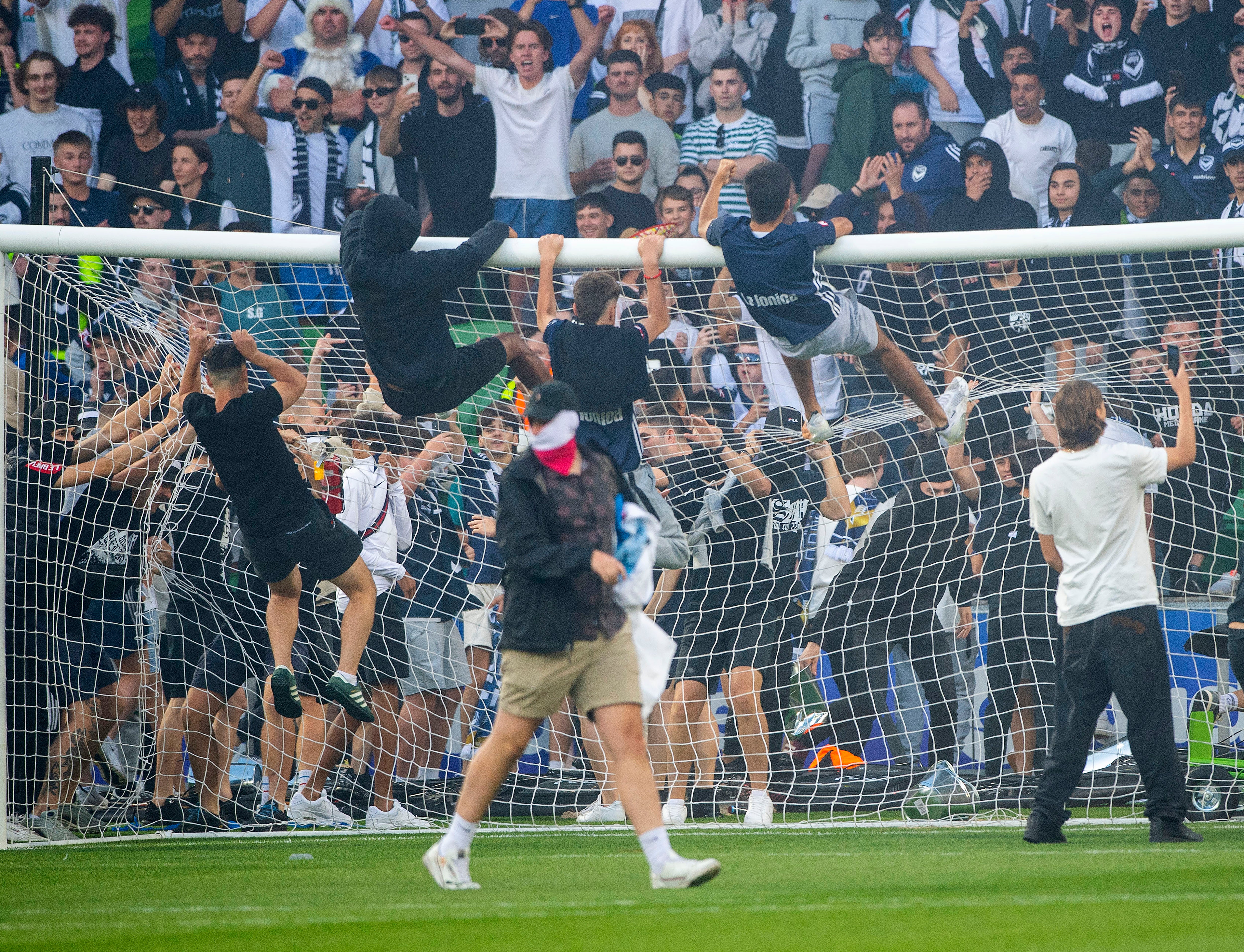 Melbourne Victory fans invade the pitch