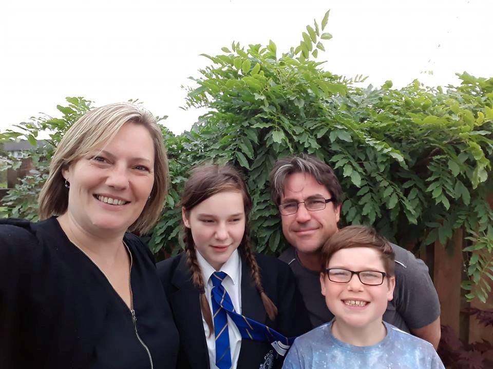 Mr Alderson with his wife, Leann, and their children, Rebecah and Harry