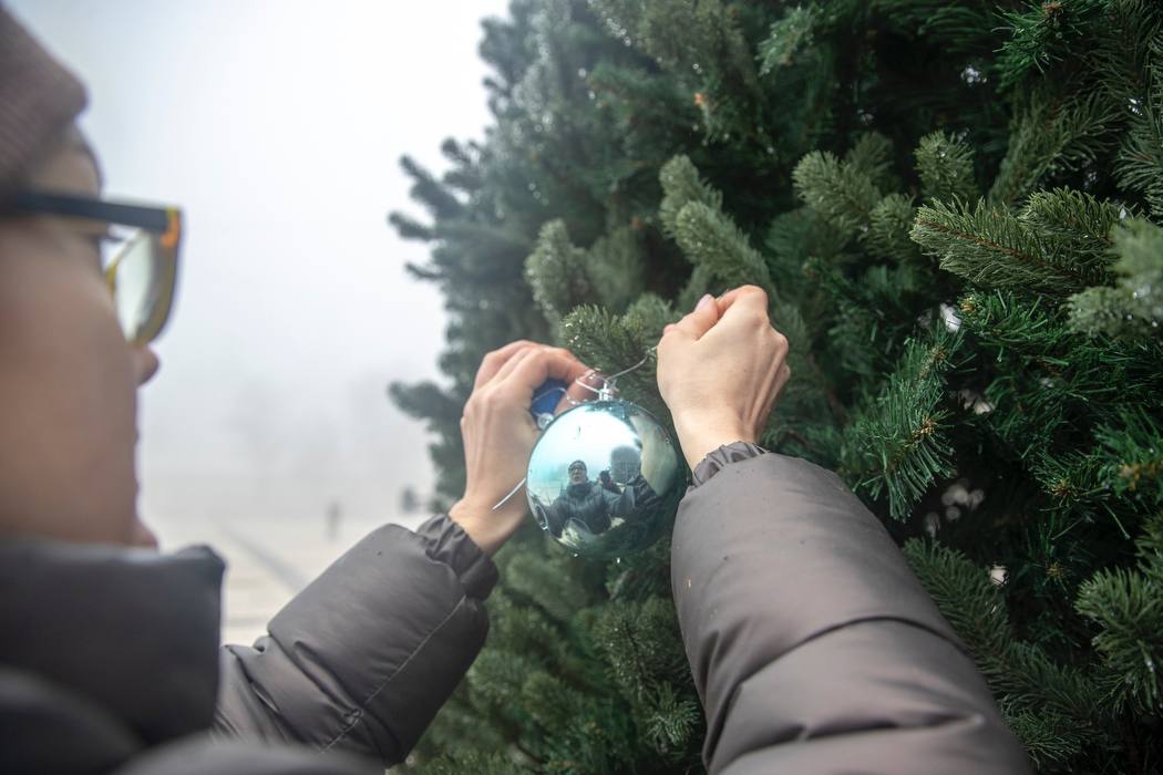 Adding baubles to the base of the tree